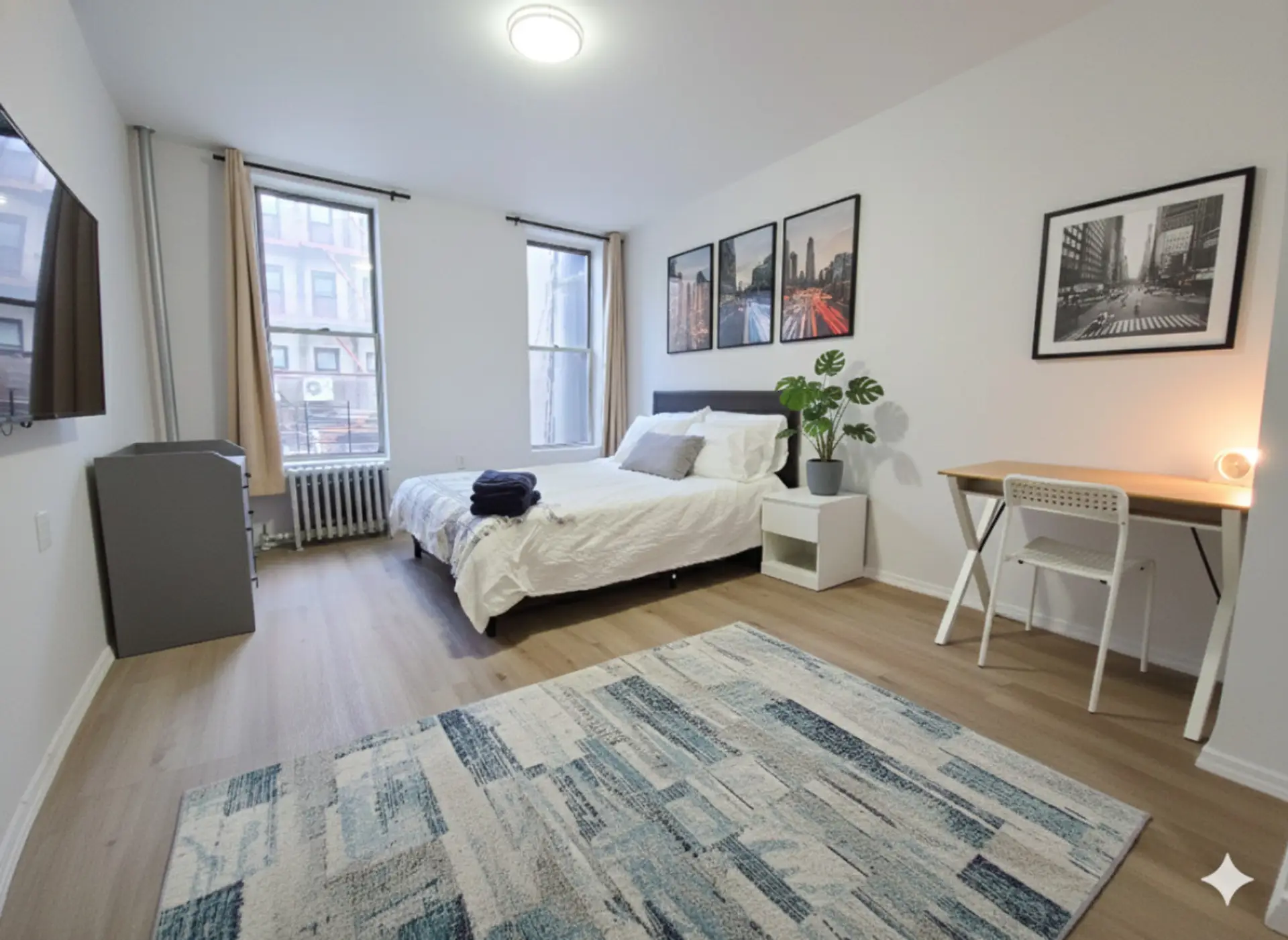 Large and Bright Bedroom with TV. Queen bed w/ black out curtains and quiet.