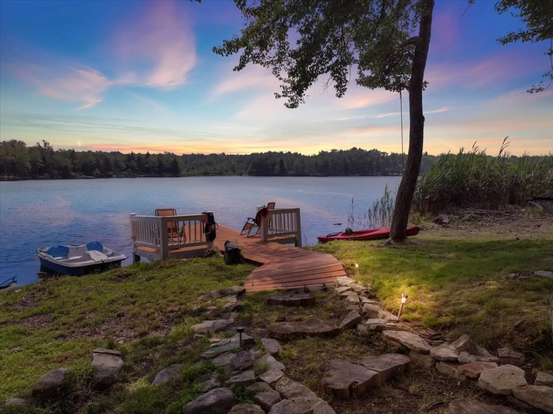 Golden hour, glassy water, and complete serenity — all from your private dock.