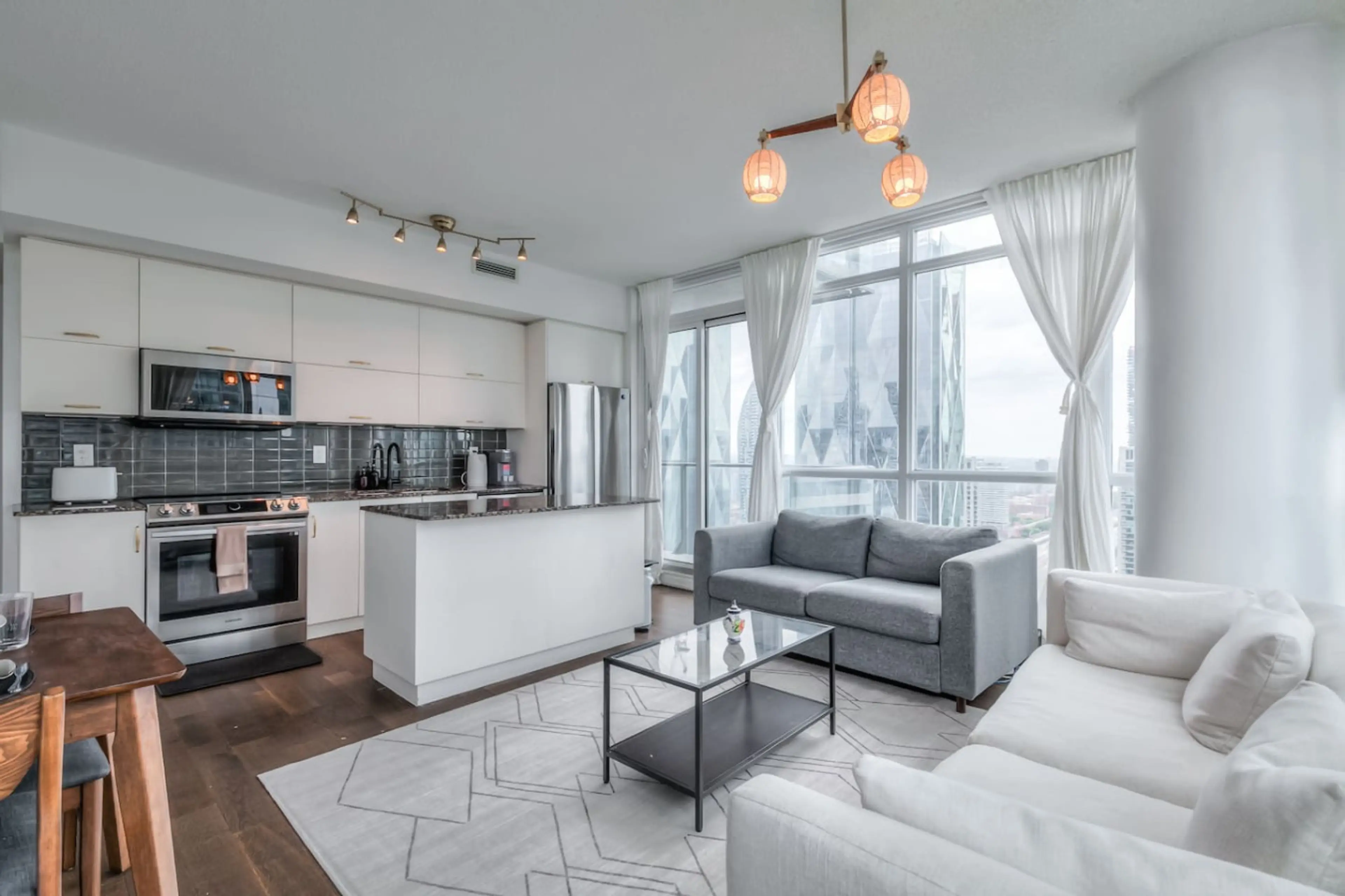 Relax in a cozy living room with a Smart TV and city views.