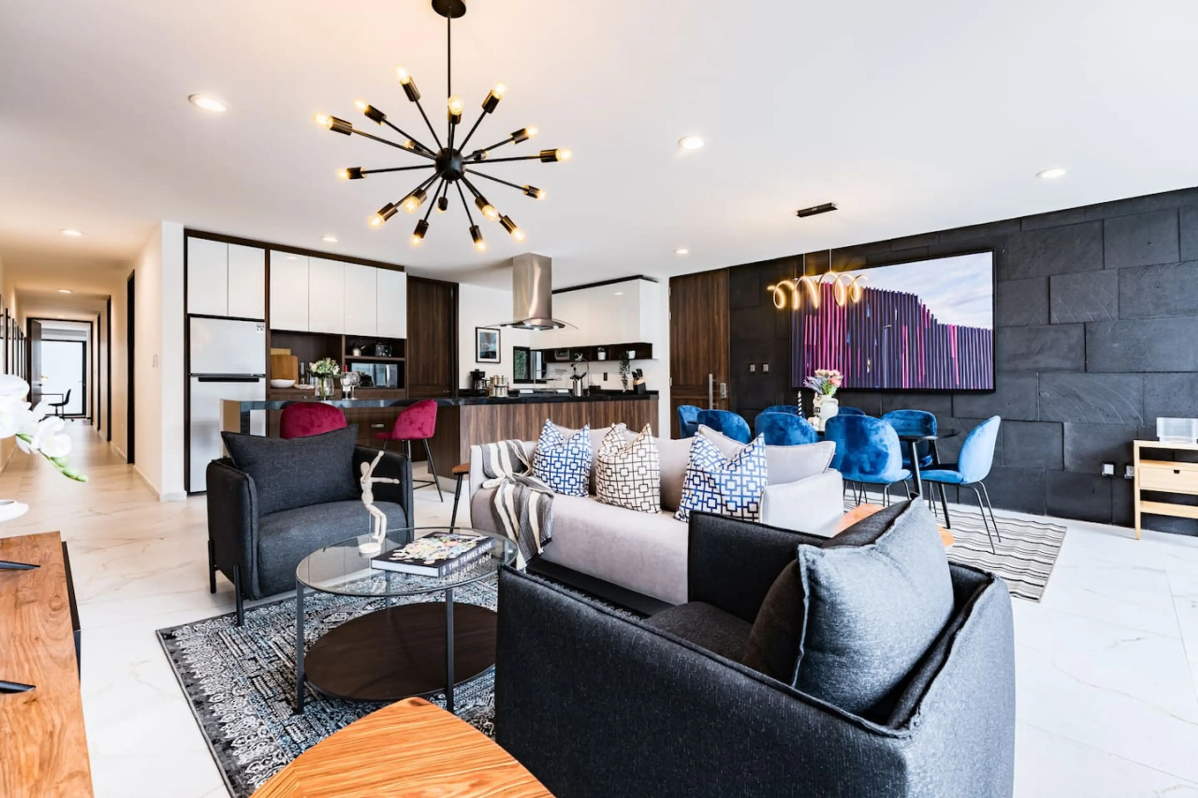 Sleek living room designed for comfort, with plenty of seating and natural light