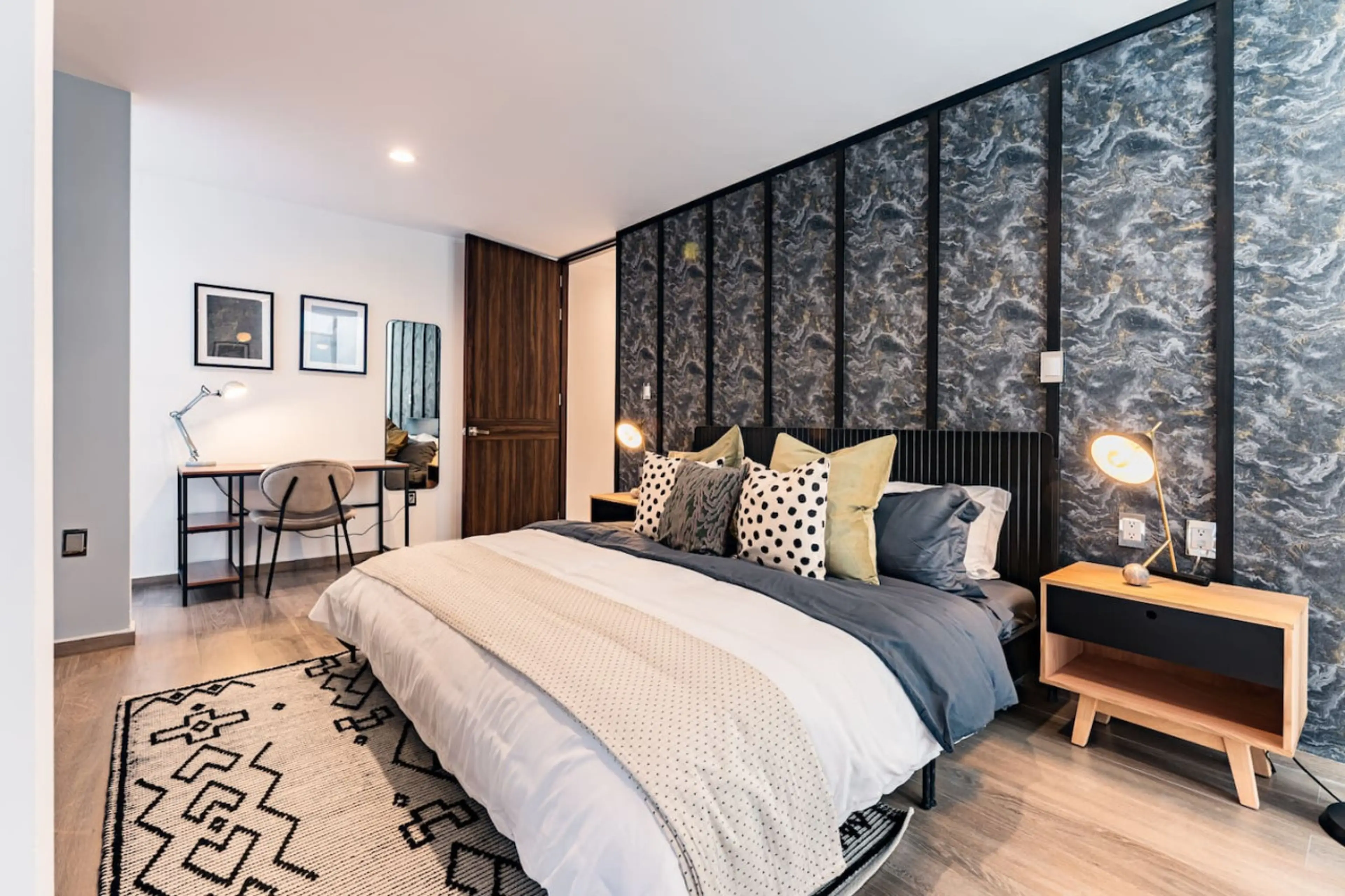 The master bedroom is a peaceful retreat with ample storage and soft lighting