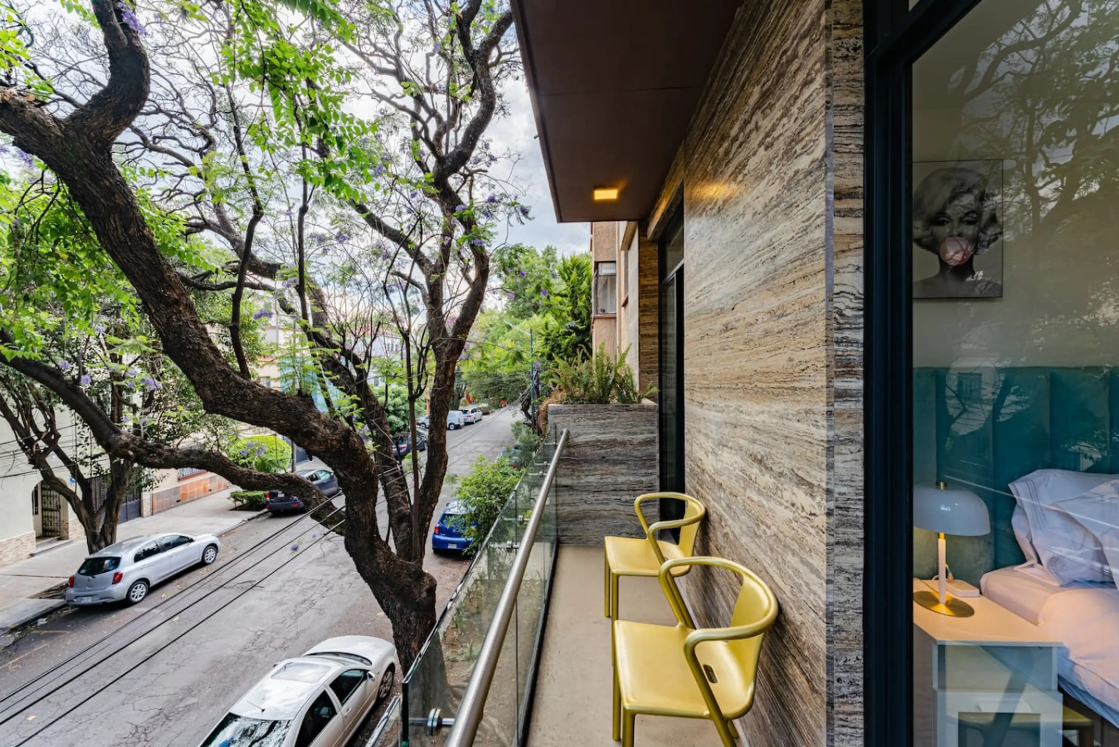 Urban treehouse vibes. Step onto your balcony for a dose of calm.