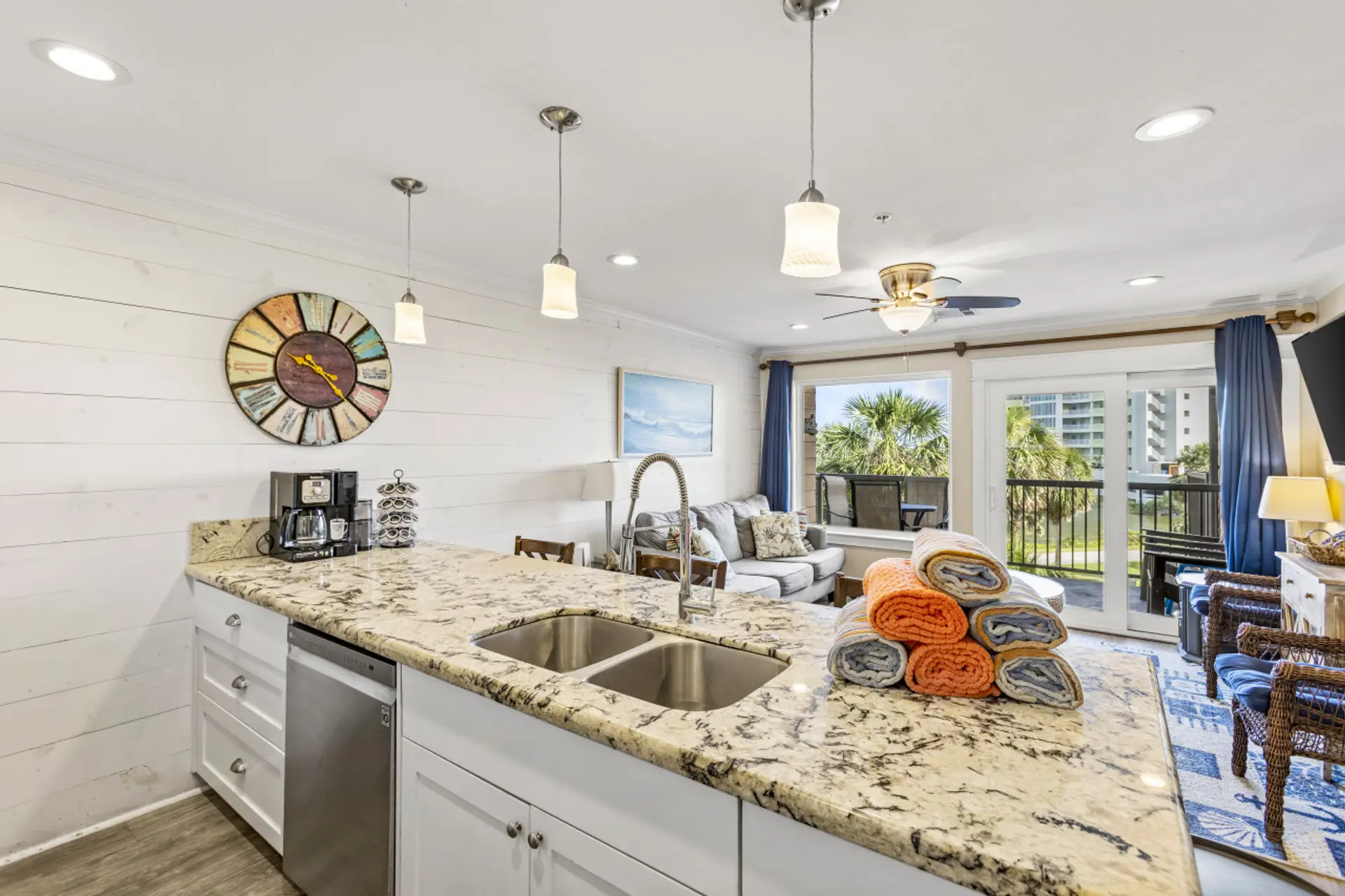 Inviting kitchen and living area with balcony access and scenic views