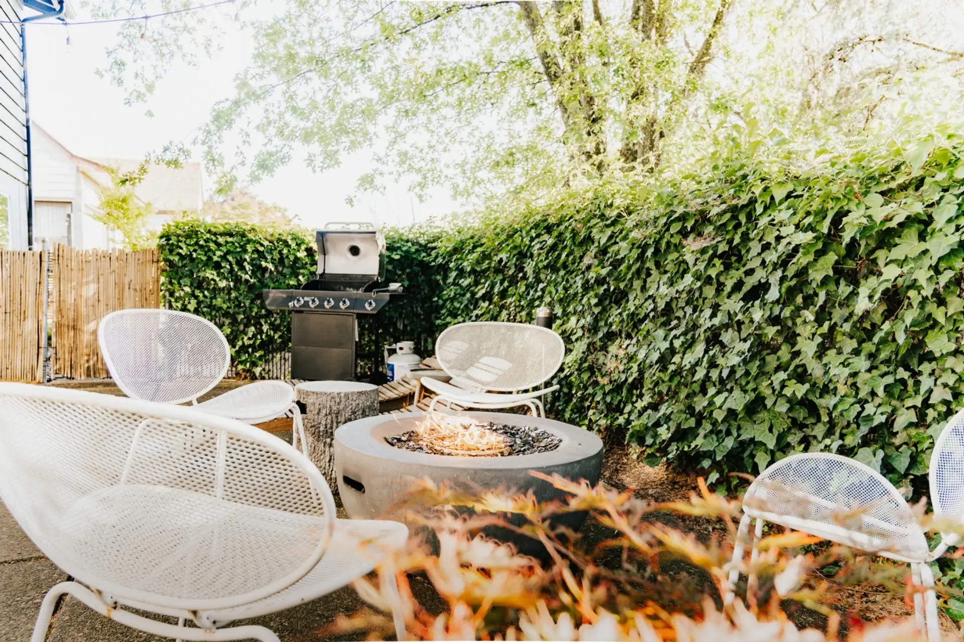 Step into tranquility. Savor quiet evenings by the fire in our Japandi-inspired garden retreat, complete with cozy seating and an outdoor grill for al fresco dining.