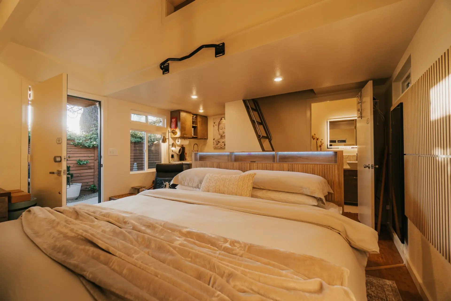 Restorative sleep on a premium King mattress. The modern frame features a built-in headboard shelf and two discreet pull-out drawers at the foot of the bed for your gear.