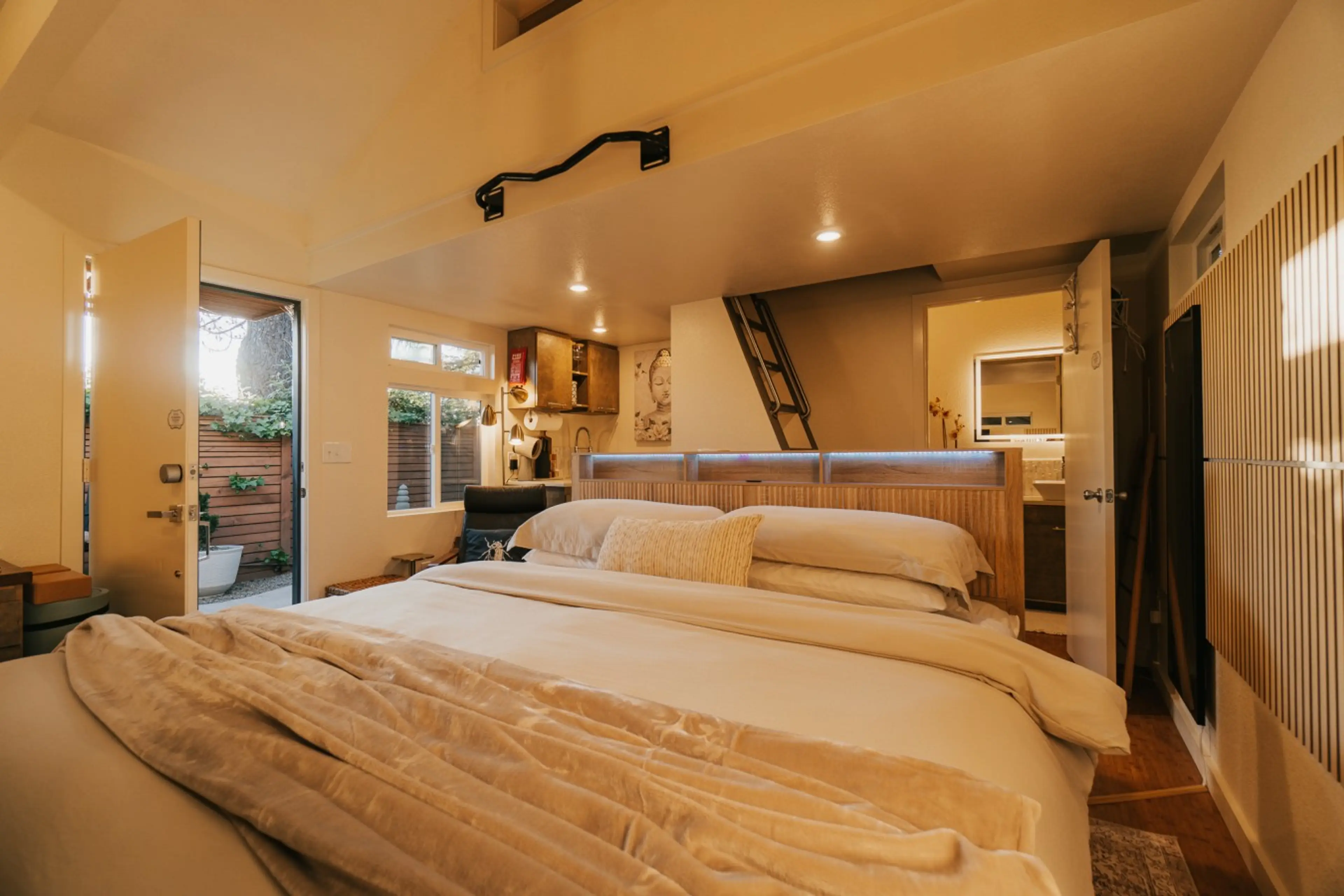 Restorative sleep on a premium King mattress. The modern frame features a built-in headboard shelf and two discreet pull-out drawers at the foot of the bed for your gear.