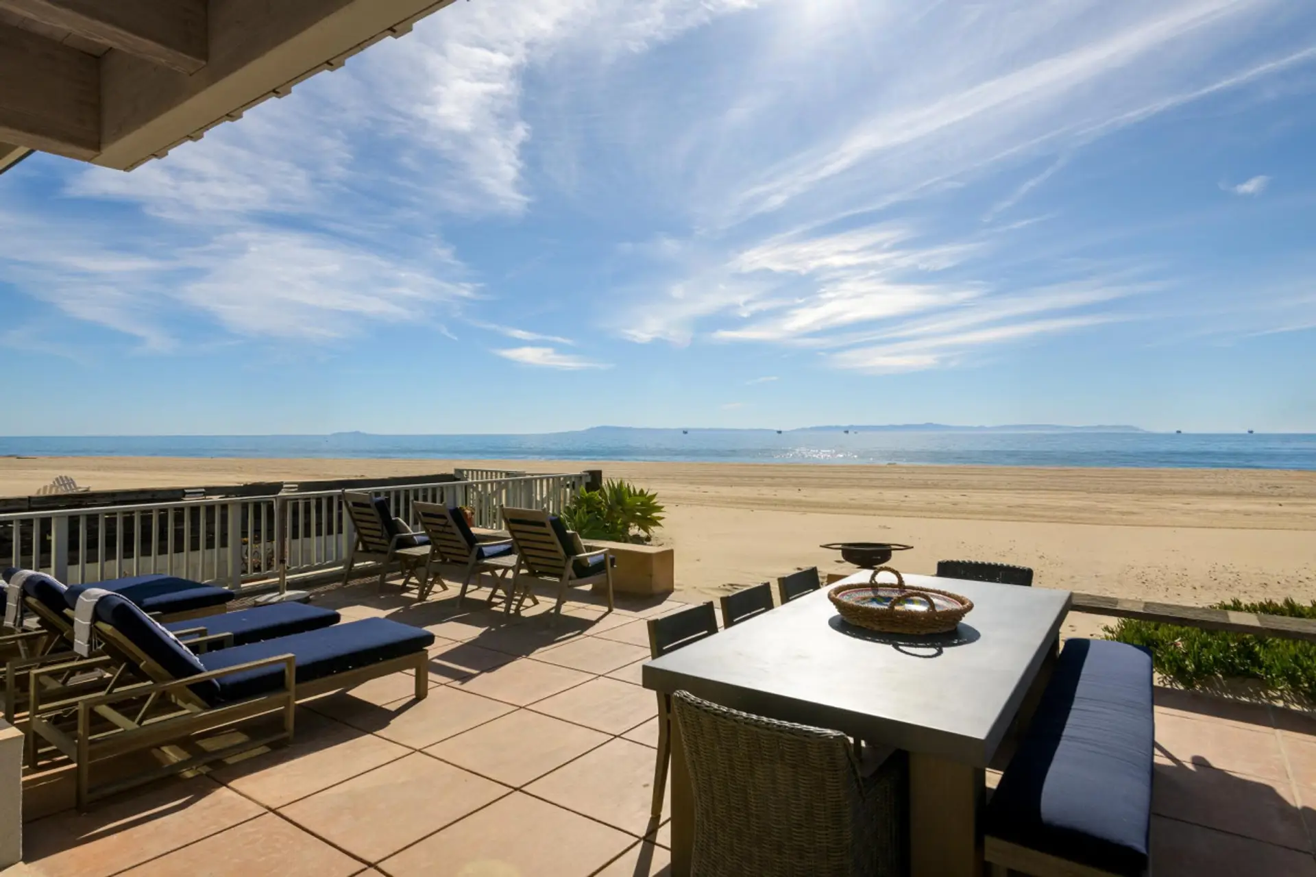 Beachfront Patio with Ample Seating and Sweeping Ocean Views