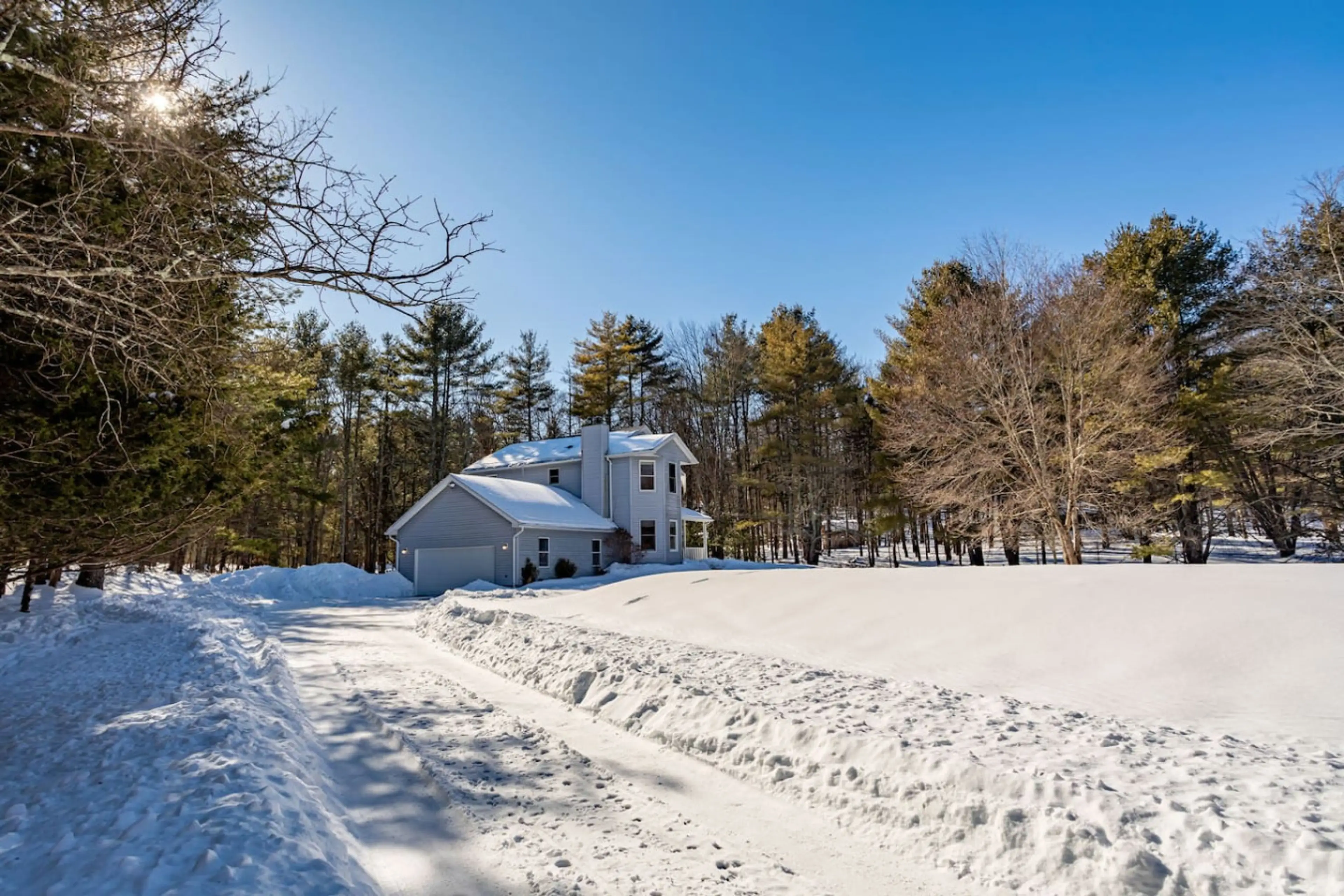 Exterior: Experience serene winter views in this beautiful Woodstock retreat, surrounded by nature!