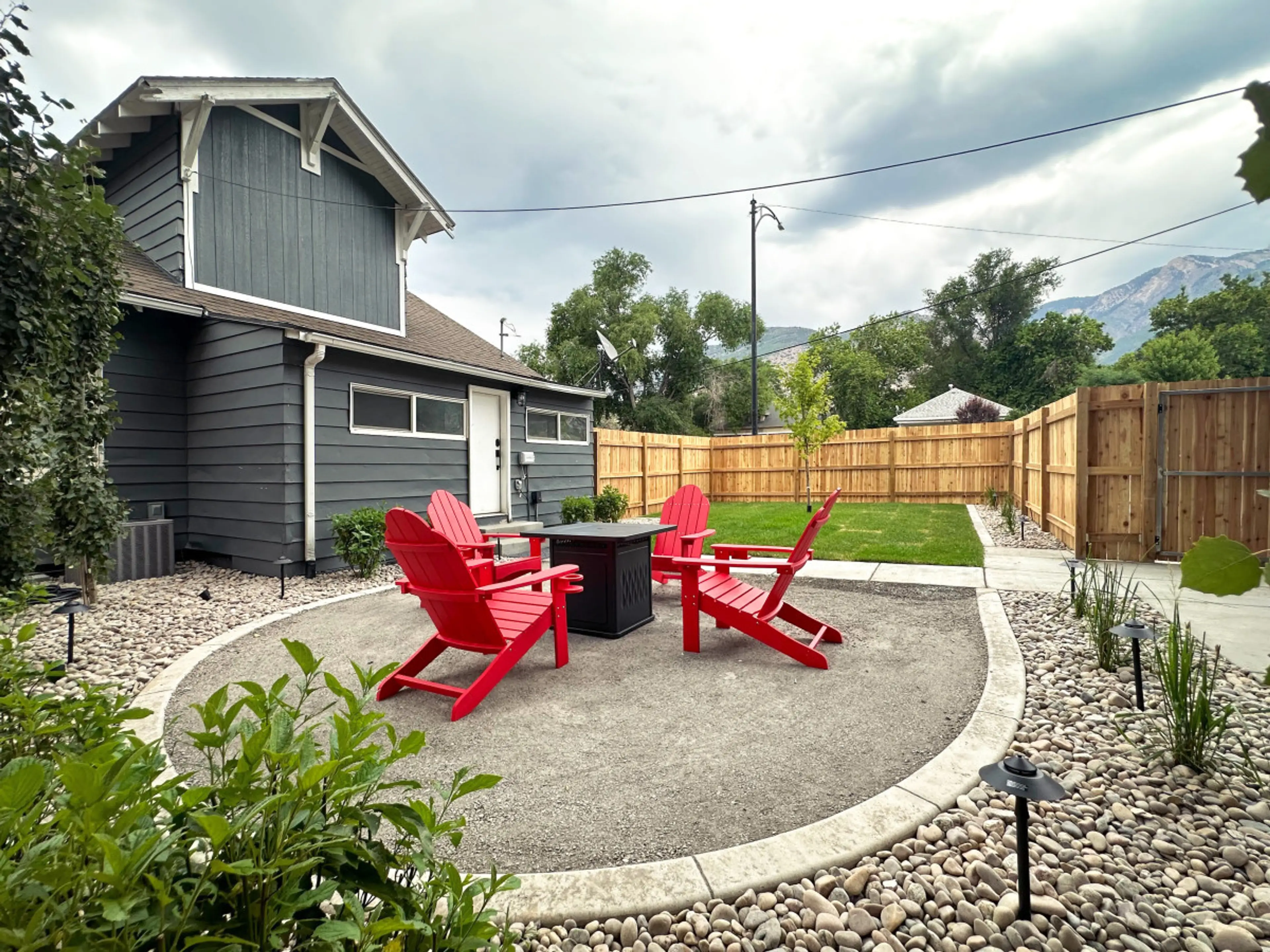 Our backyard oasis: a cozy fireplace with inviting seating for all to enjoy