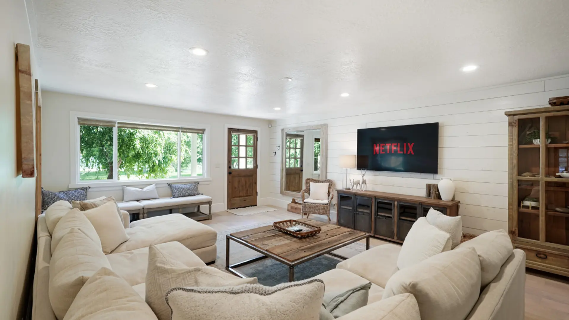 Enjoy our spacious living room with ample comfy seating, lots of natural light from large windows, and a Smart TV with streaming options