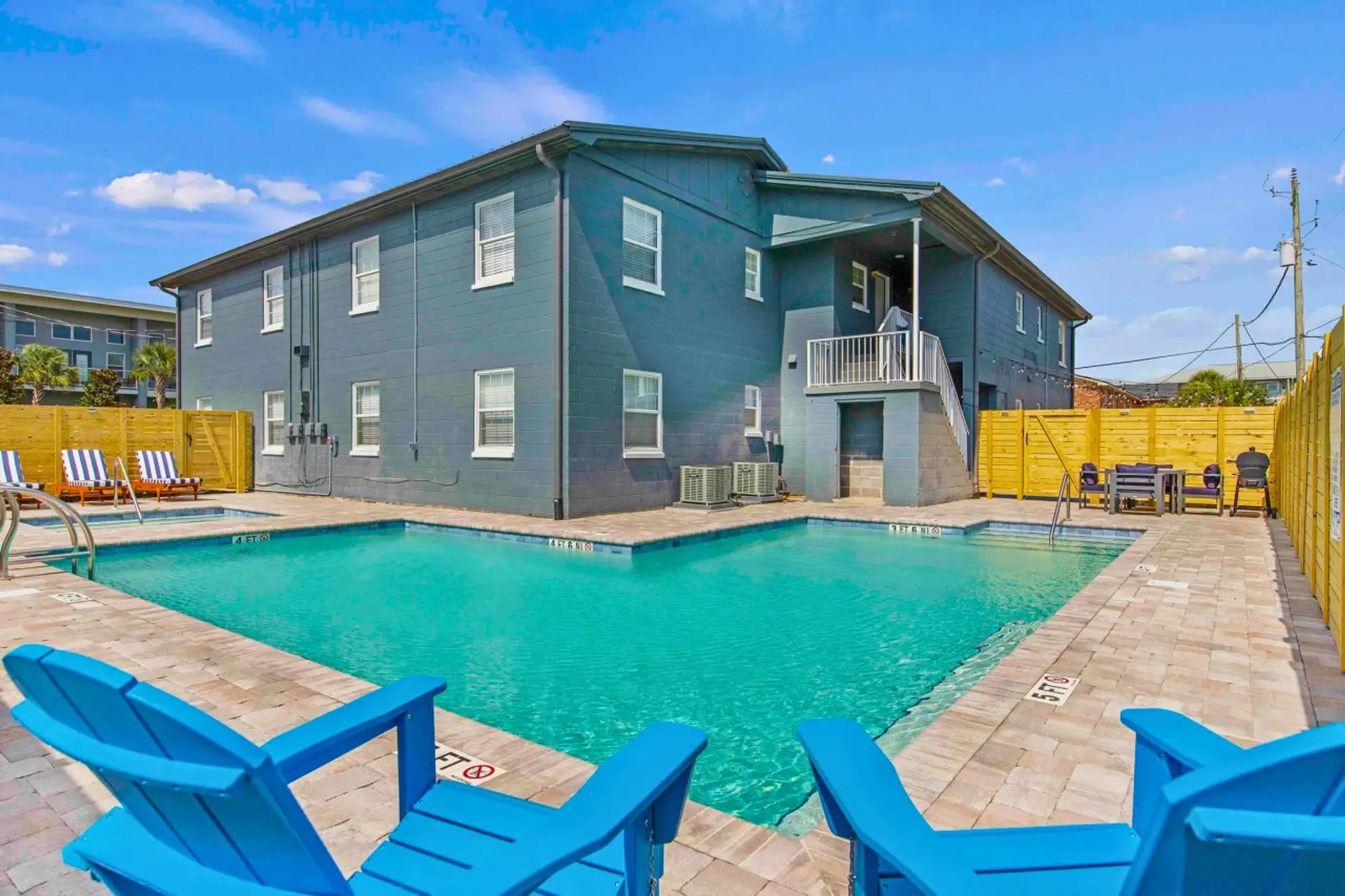 Unwind in the pool area, complete with comfortable lounge chairs