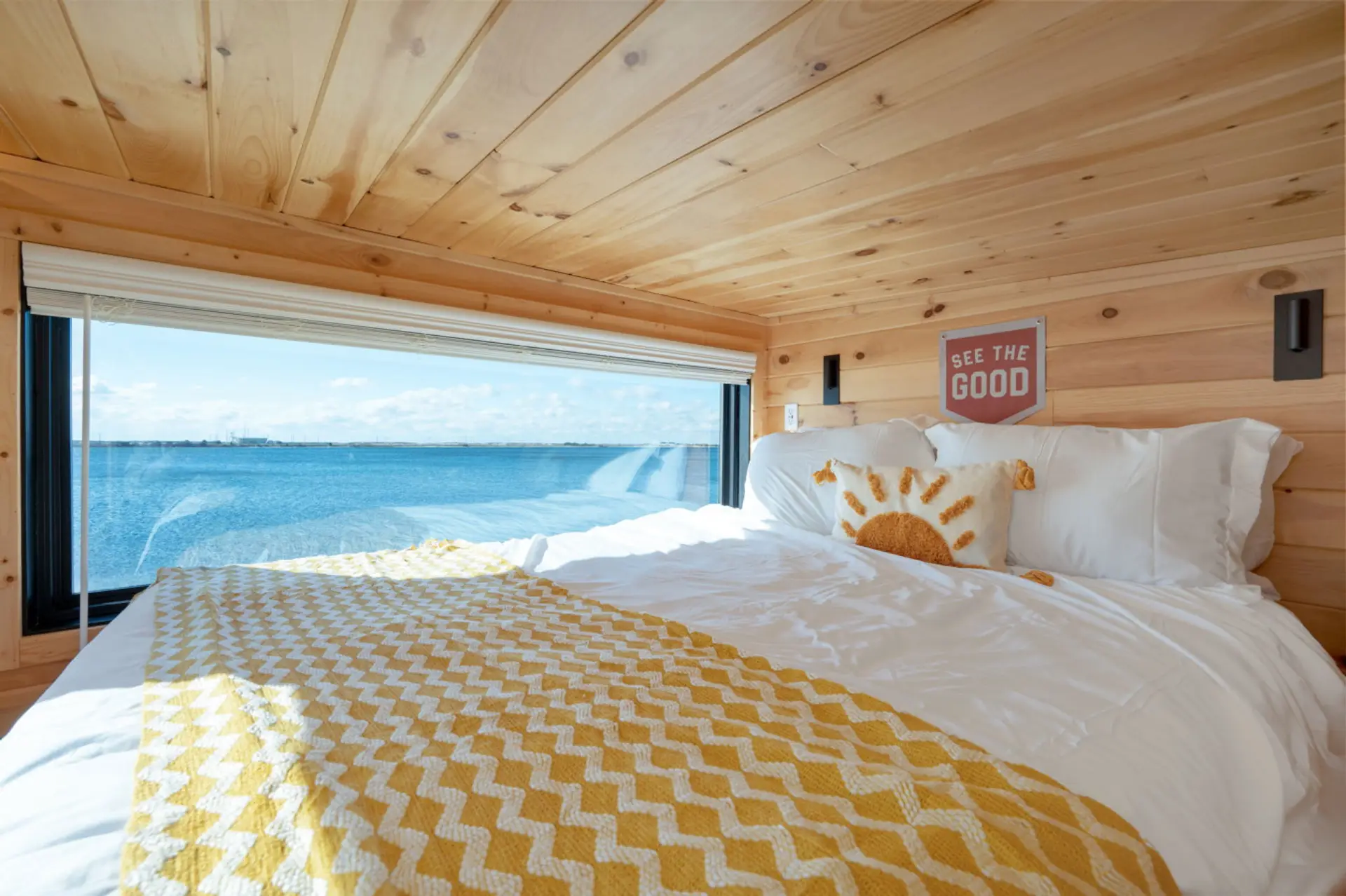 The upper bunk, with a cozy queen-size bed, perfect for relaxing and restful sleep