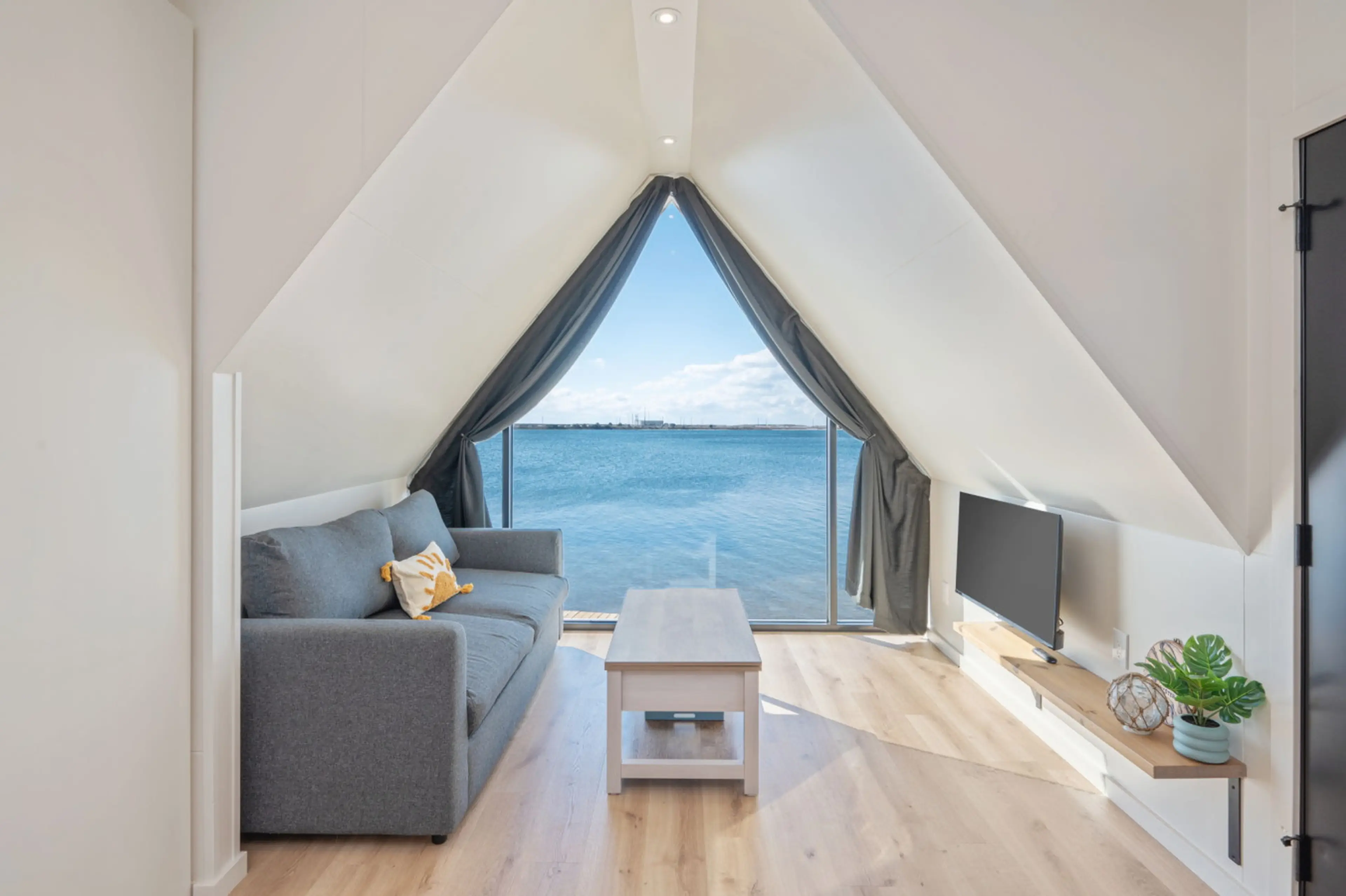 A cozy living room with calming sea views