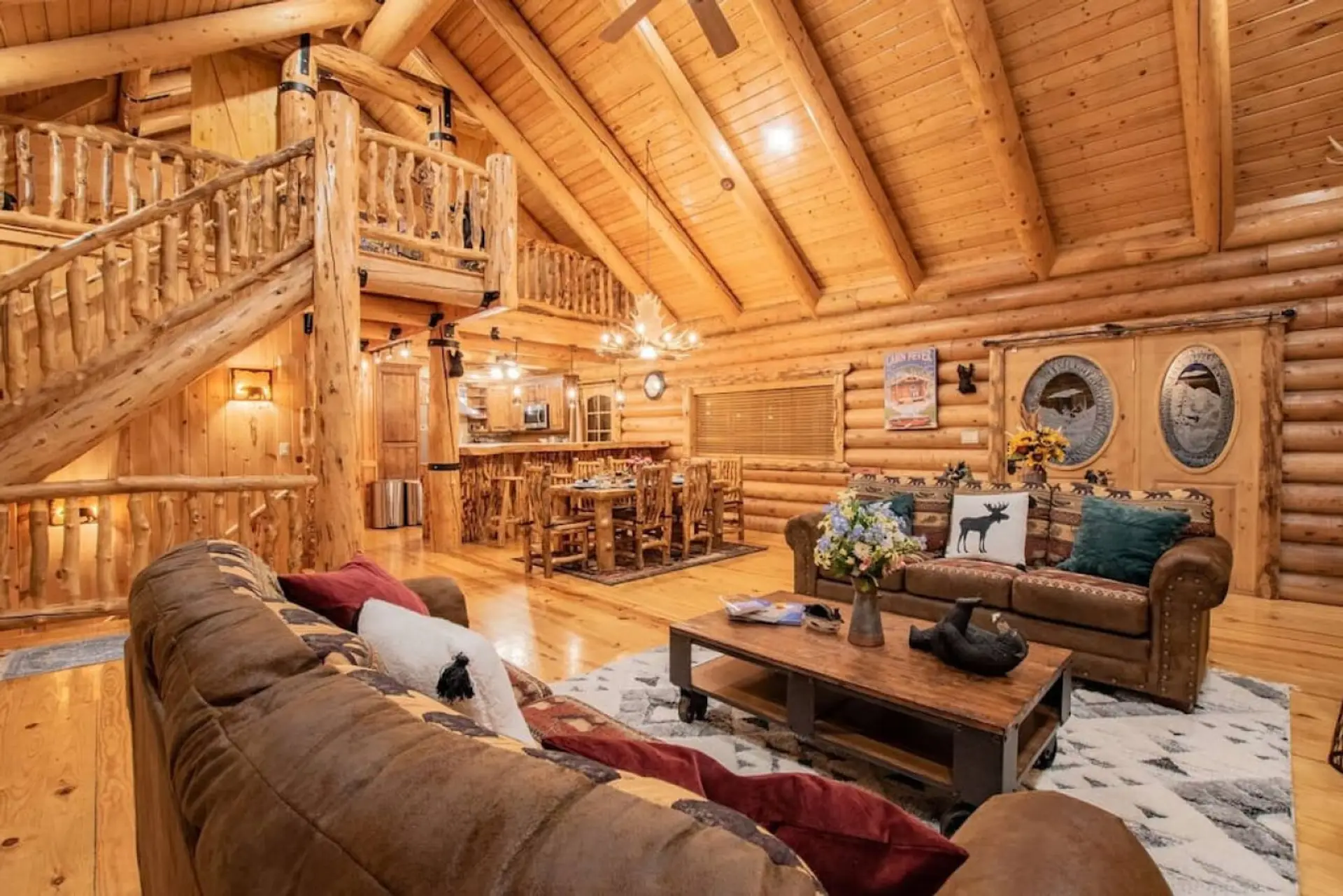 The large great room offers a spacious area to congregate, enjoy meals, and sit by the fireplace.