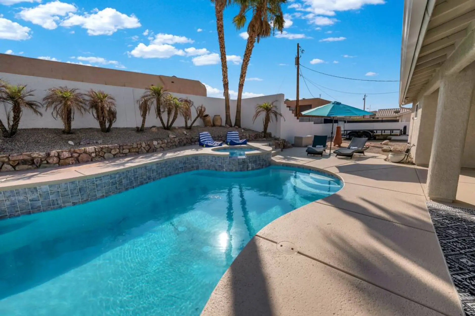 Large private backyard - heatable pool, spa, loungers, covered patio, etc.