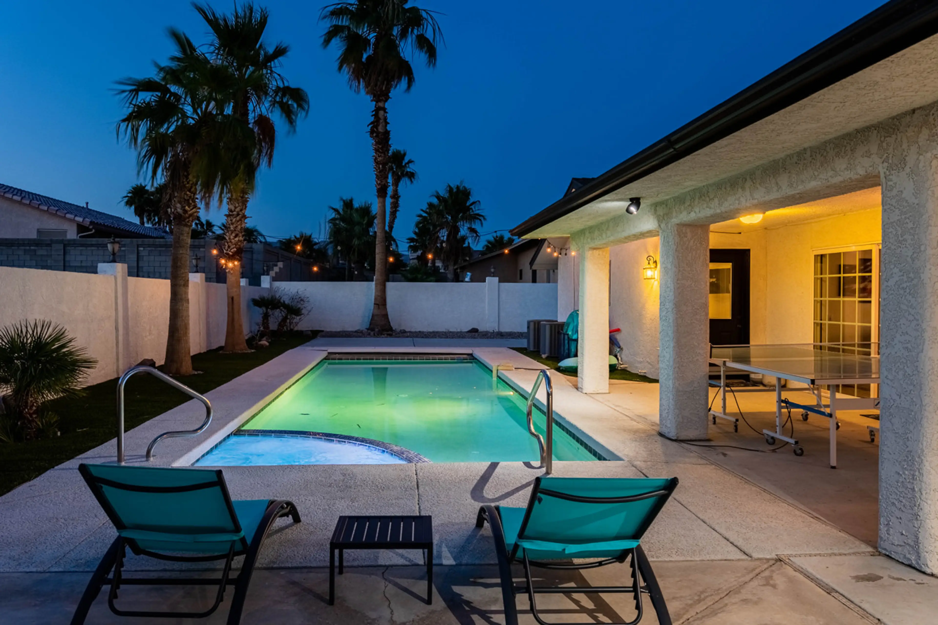 Charming covered patio for evenings by the pool.
