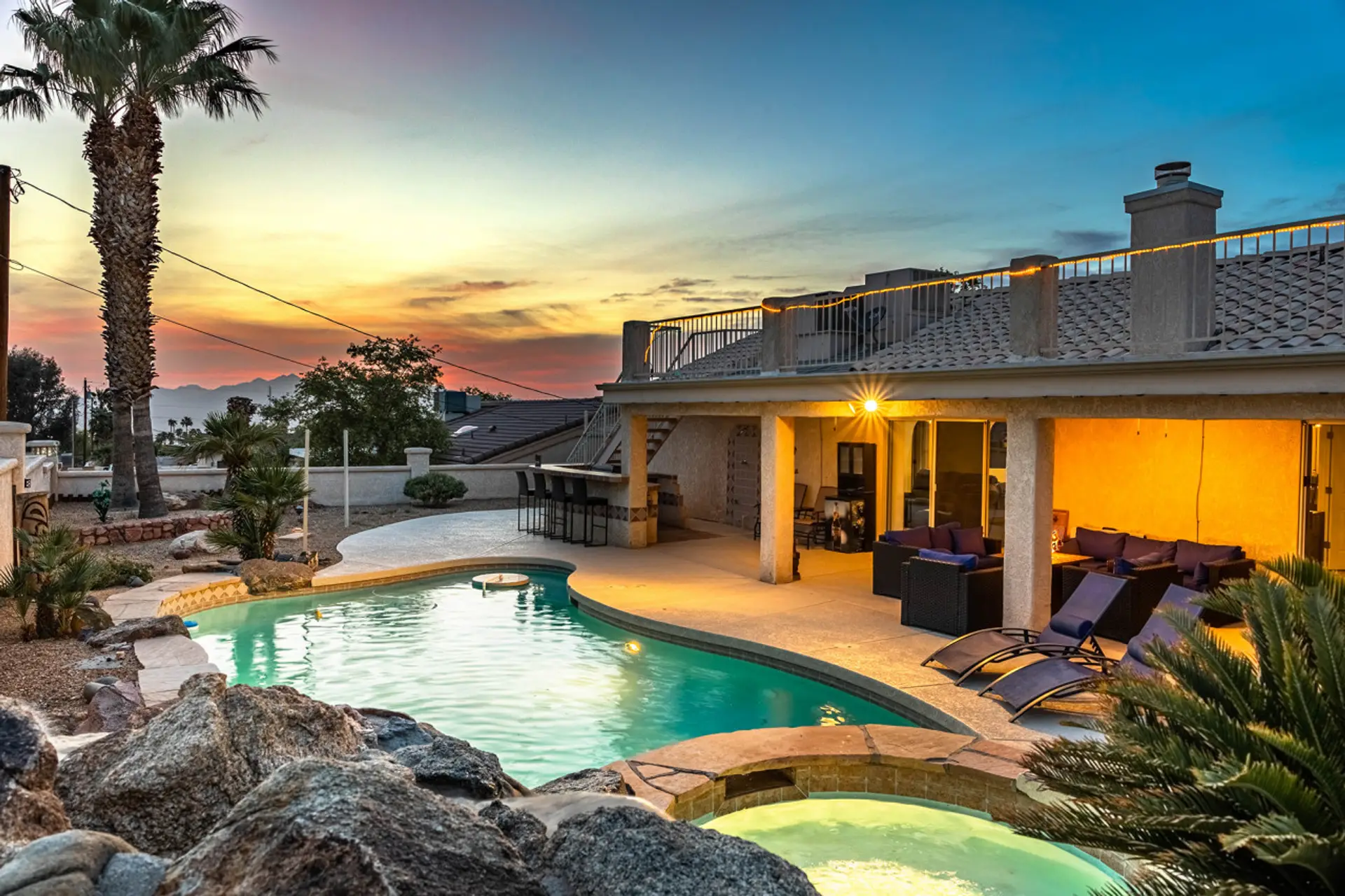 Escape to paradise in our stunning oasis, complete with a sparkling pool, relaxing spa, and cozy fire pit.