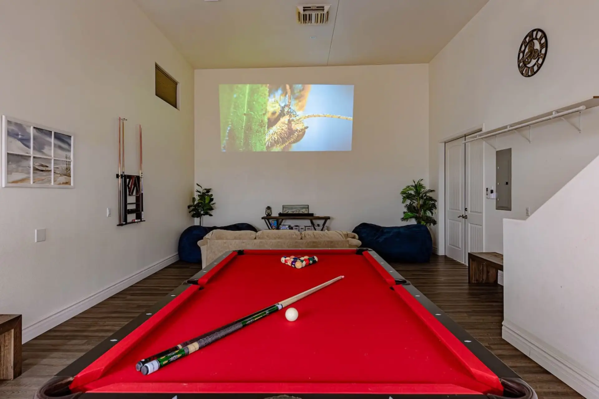Game Room with Pool Table, Air Hockey, TV Projector, Poker Table/Chips, and tons of Board Games and Card Games.
