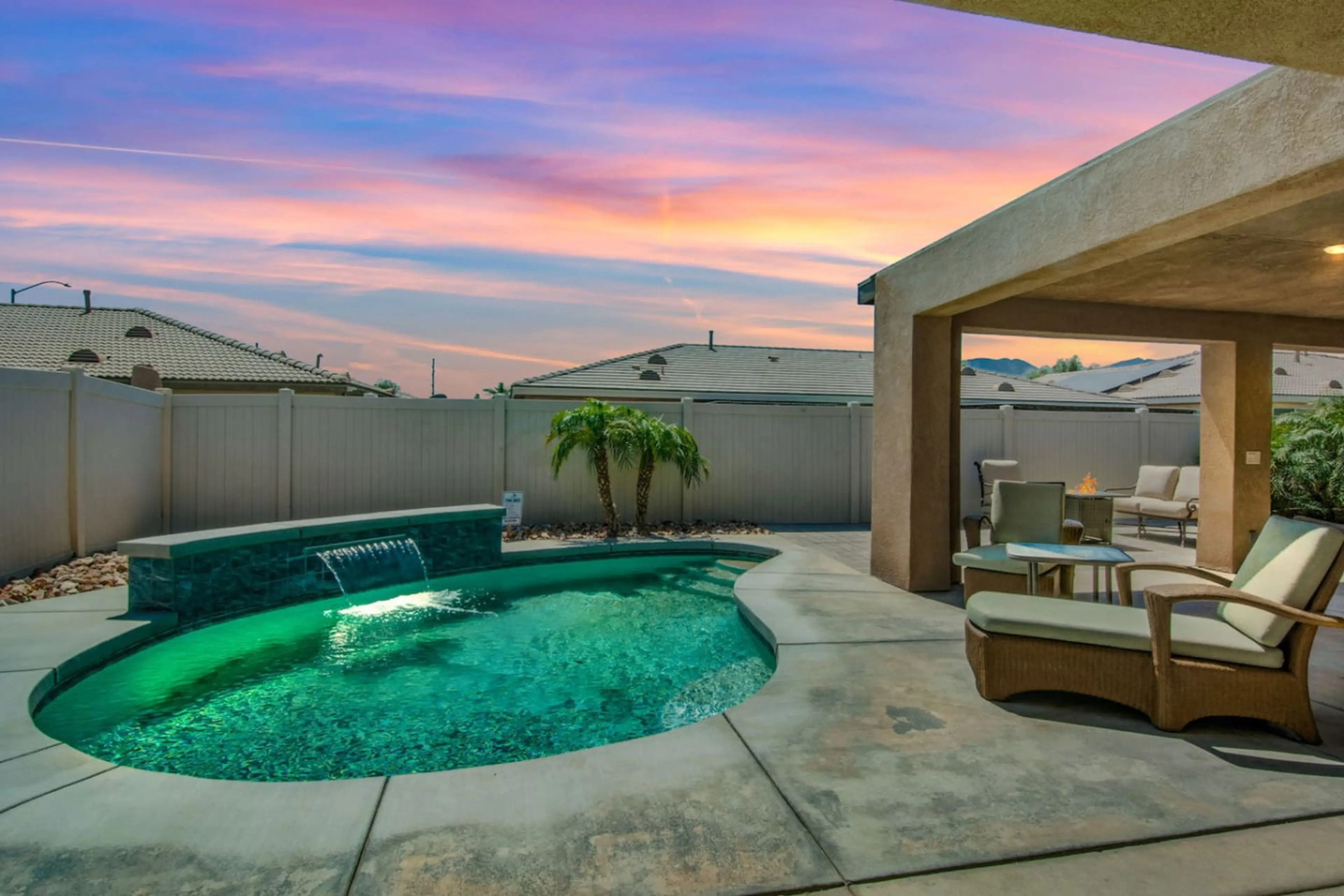 Relax under the glowing sunset in your private pool oasis.