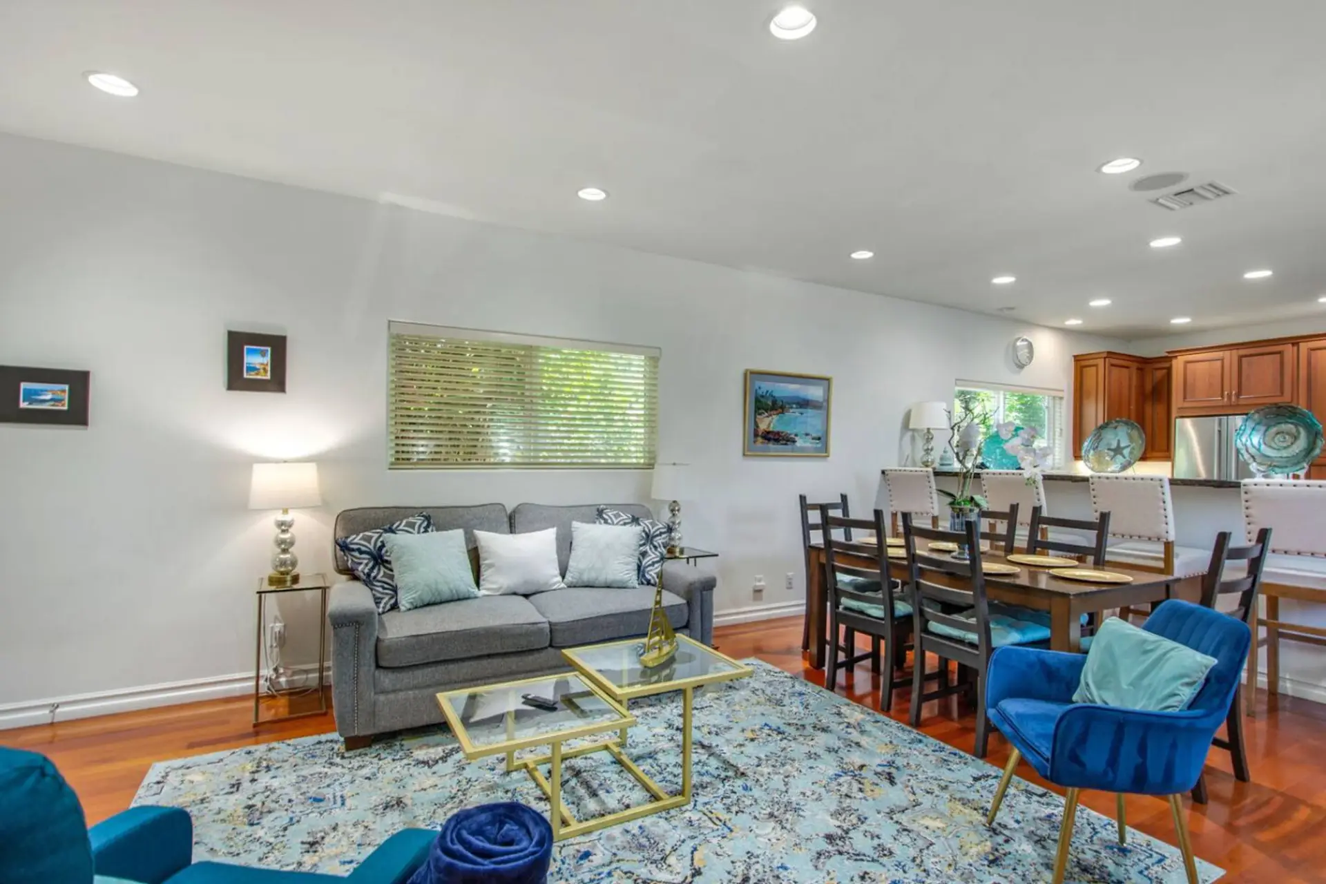 The ADU living room offers a cozy sofa sleeper, Smart TV, and a dining table that seats six—perfect for meals or game nights