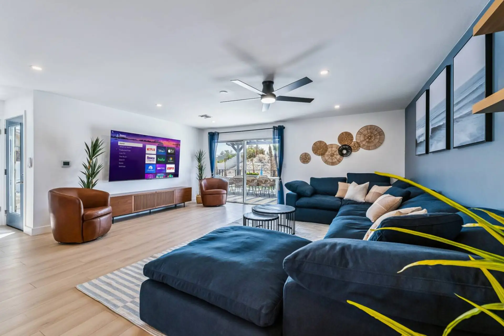 Spacious open-concept living room with comfortable couch seating and Smart TV (log in to your favorite streaming apps).