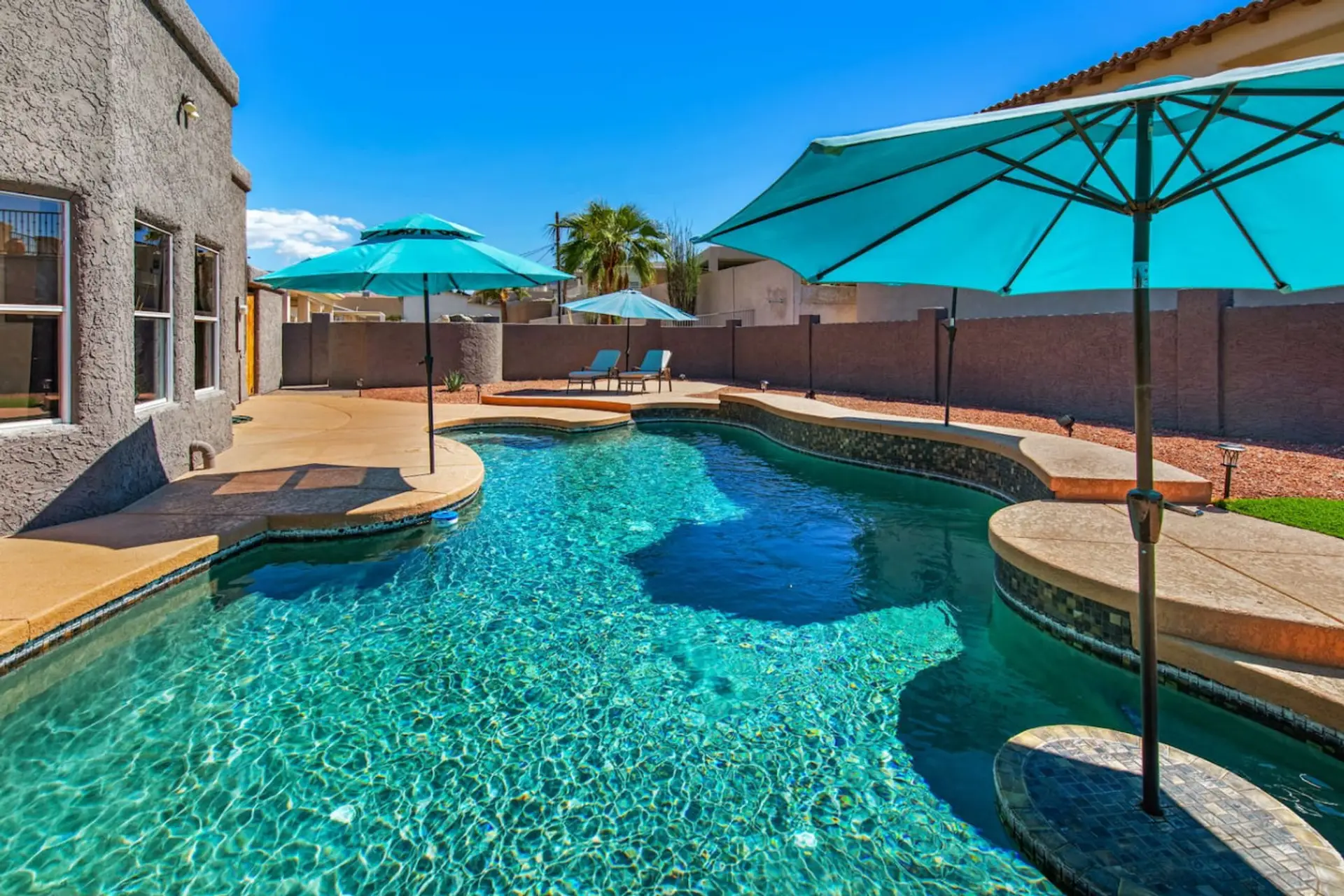 Dive into relaxation at The Golden Hour Getaway! Enjoy our sparkling pool, perfect for a refreshing escape.