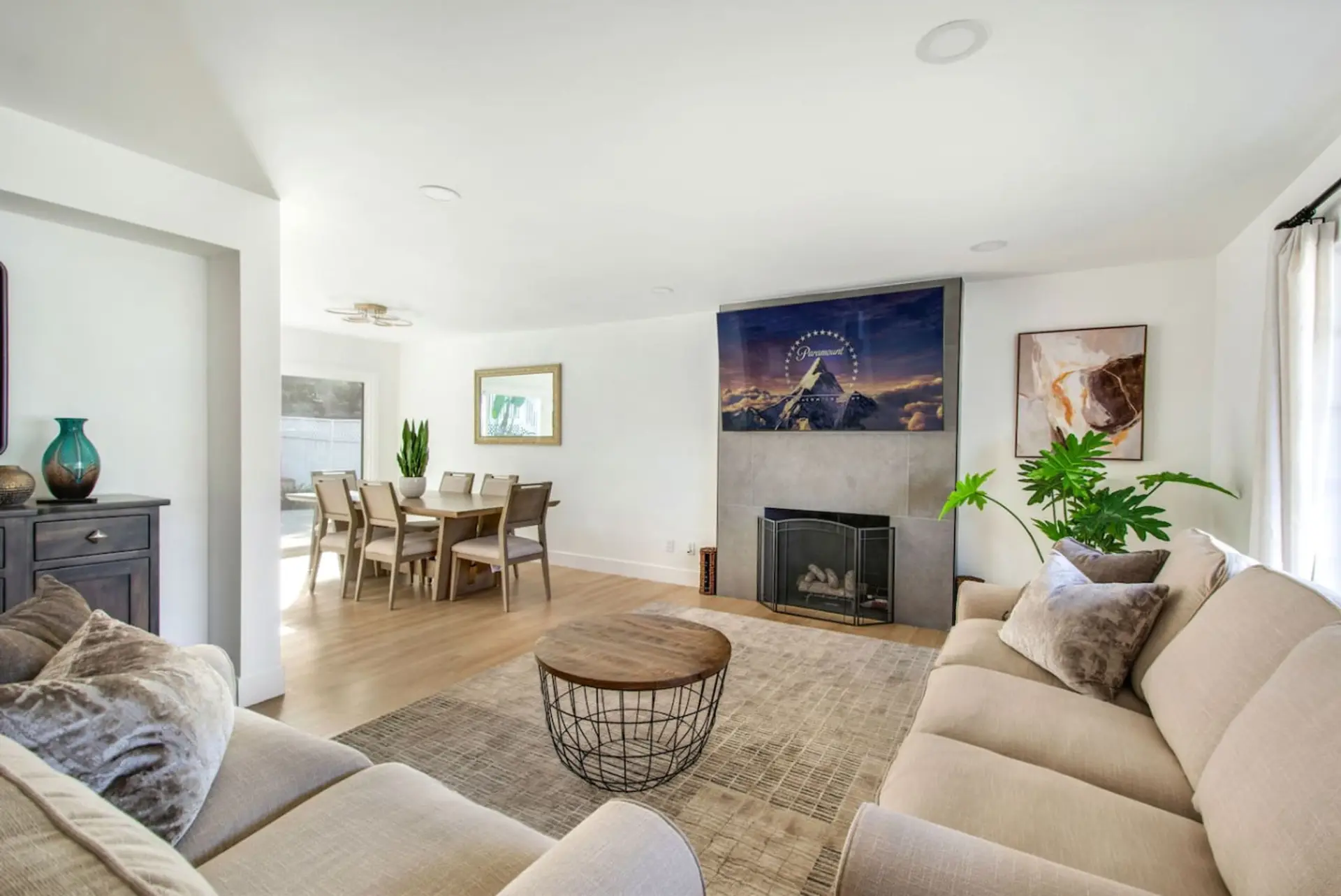 Bright open-concept living/dining area with comfortable seating