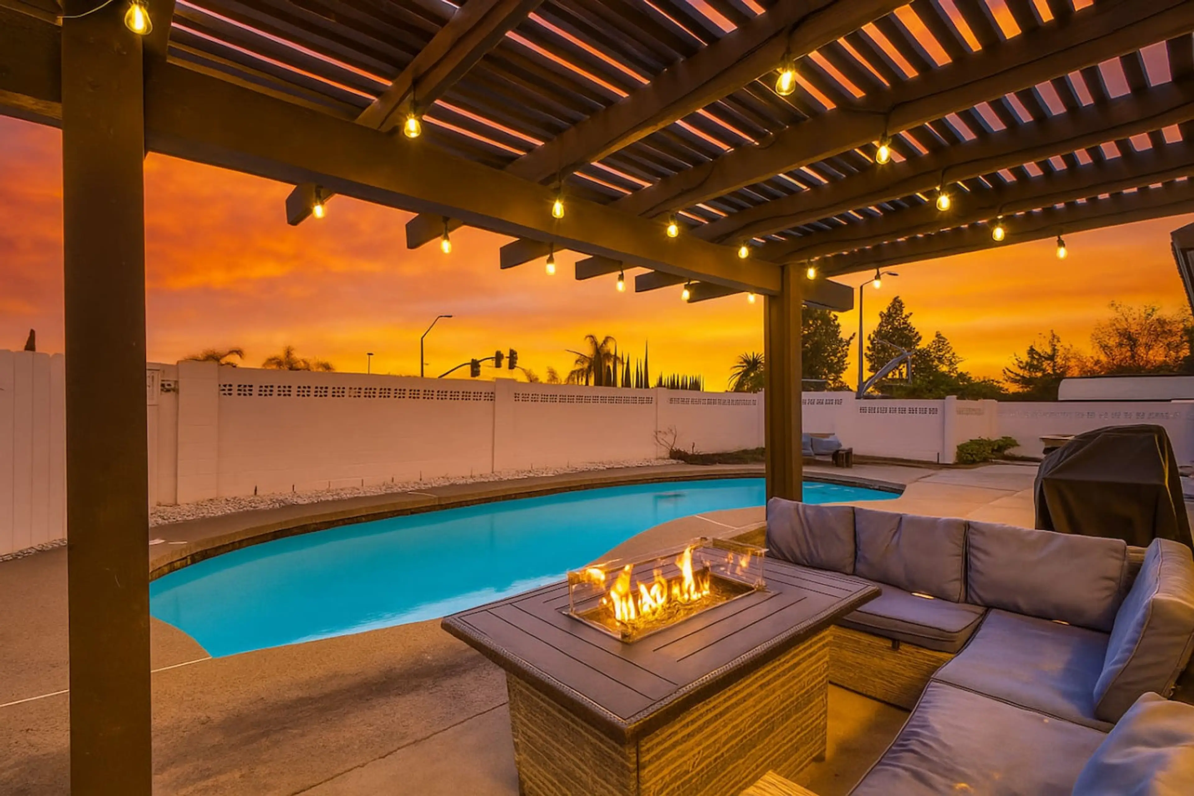 Enjoy golden sunsets by the poolside firepit — the perfect spot to unwind after a day of adventure.Step into style — this cozy corner blends modern comfort with a touch of mid-century charm.