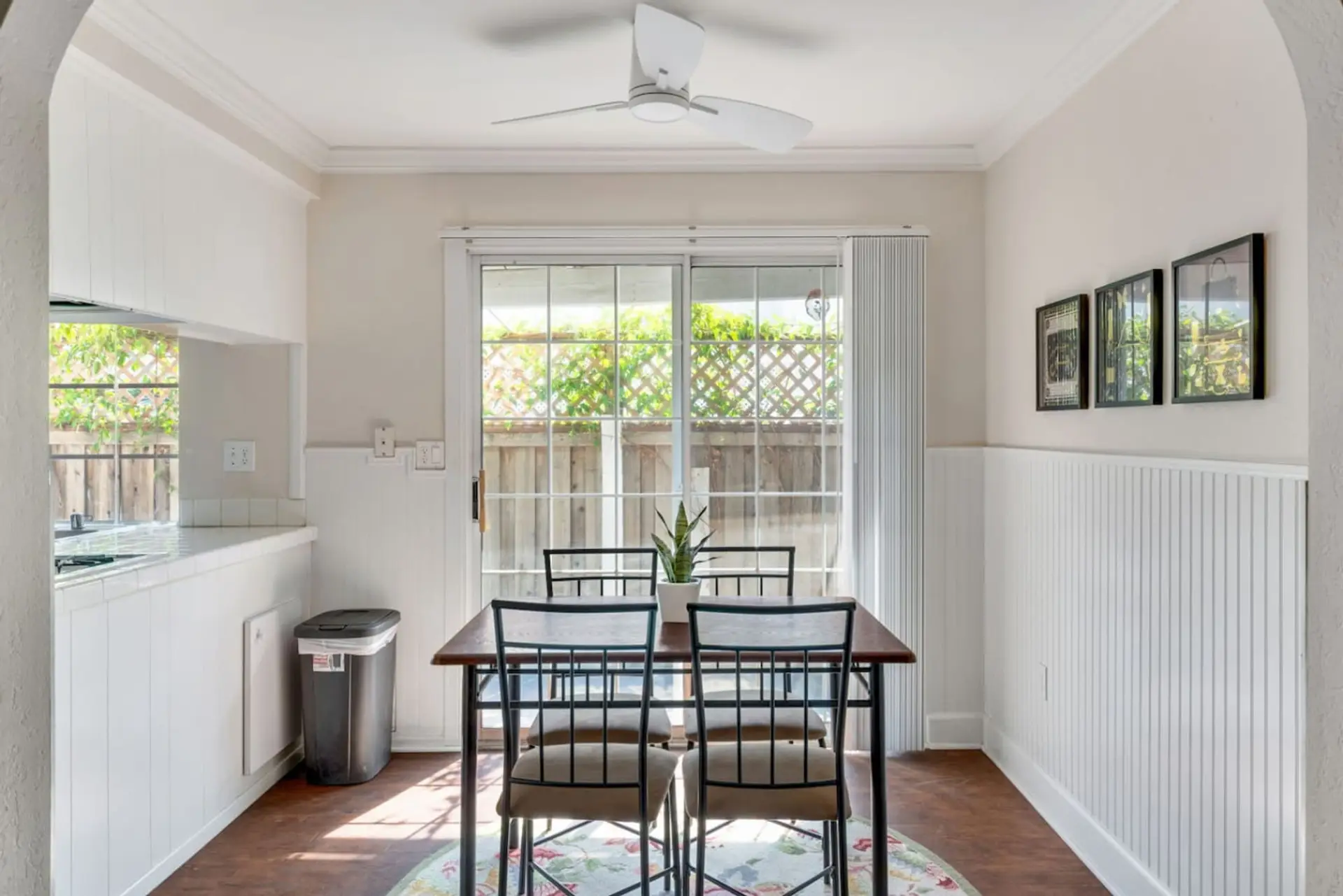 Enjoy home-cooked meals in the sunlit dining area by the patio.