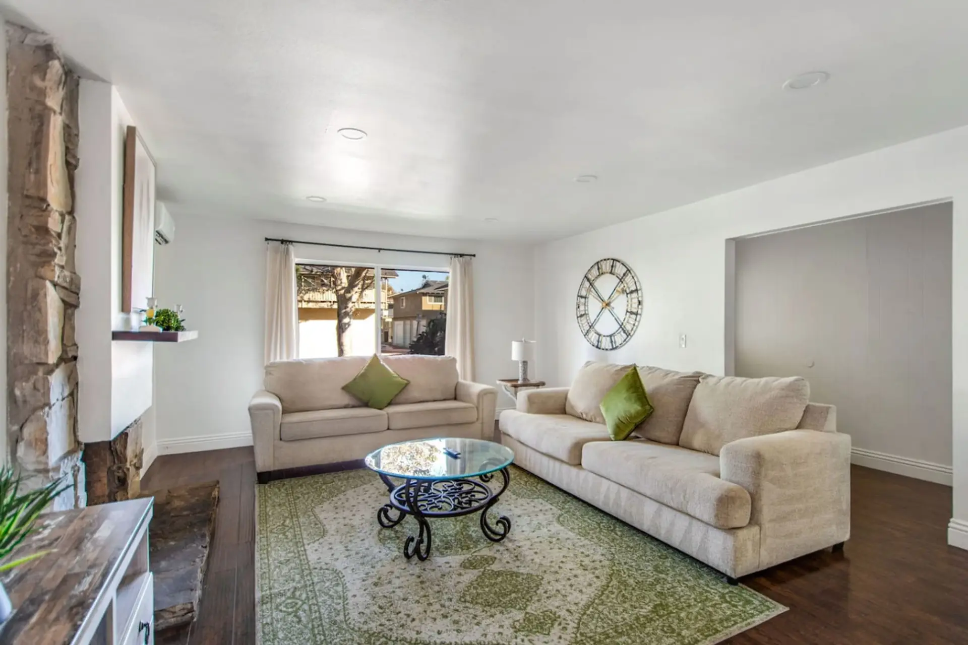 Bright and cozy living room with soft seating and natural light