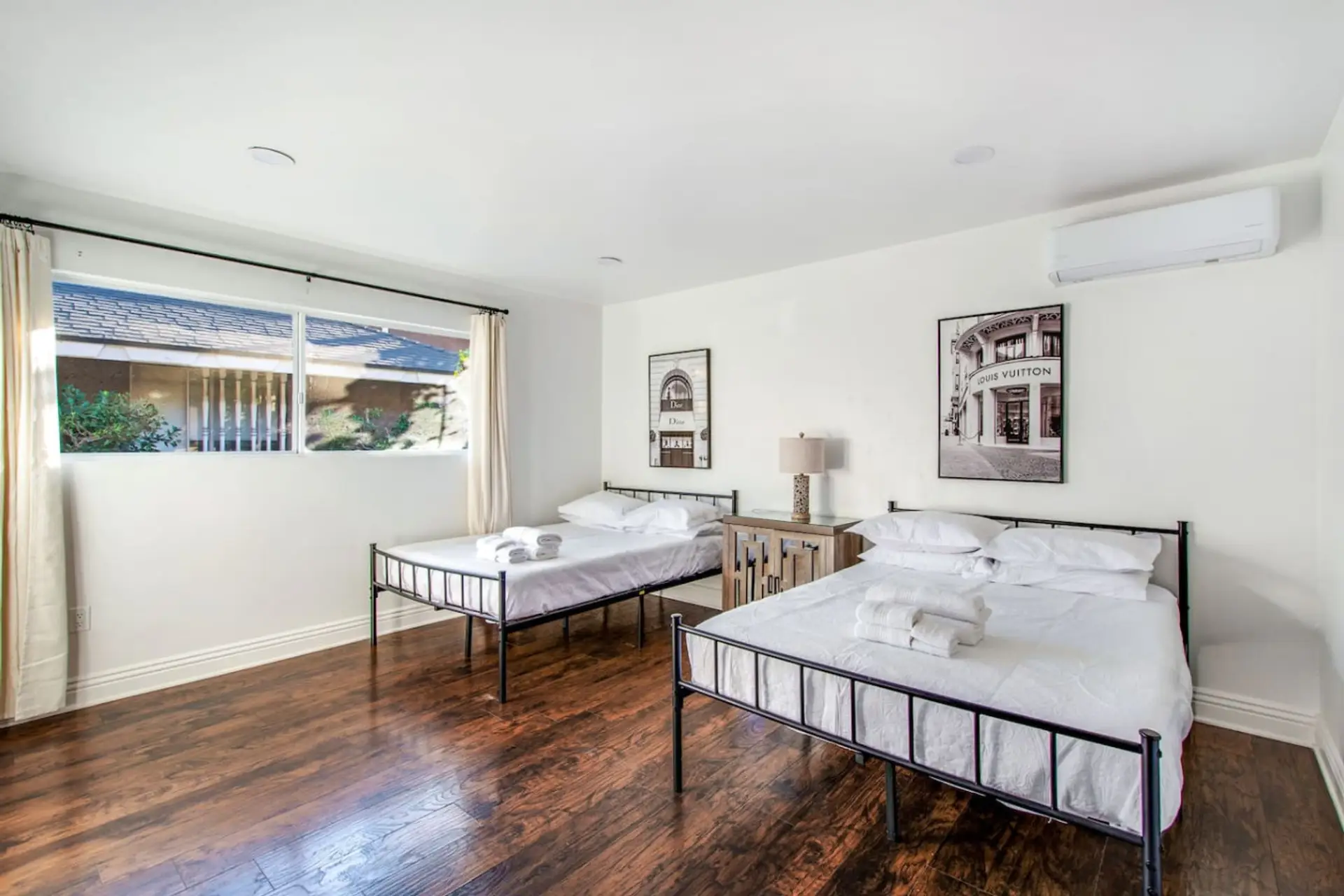 Spacious bedroom with two full beds and a peaceful atmosphere