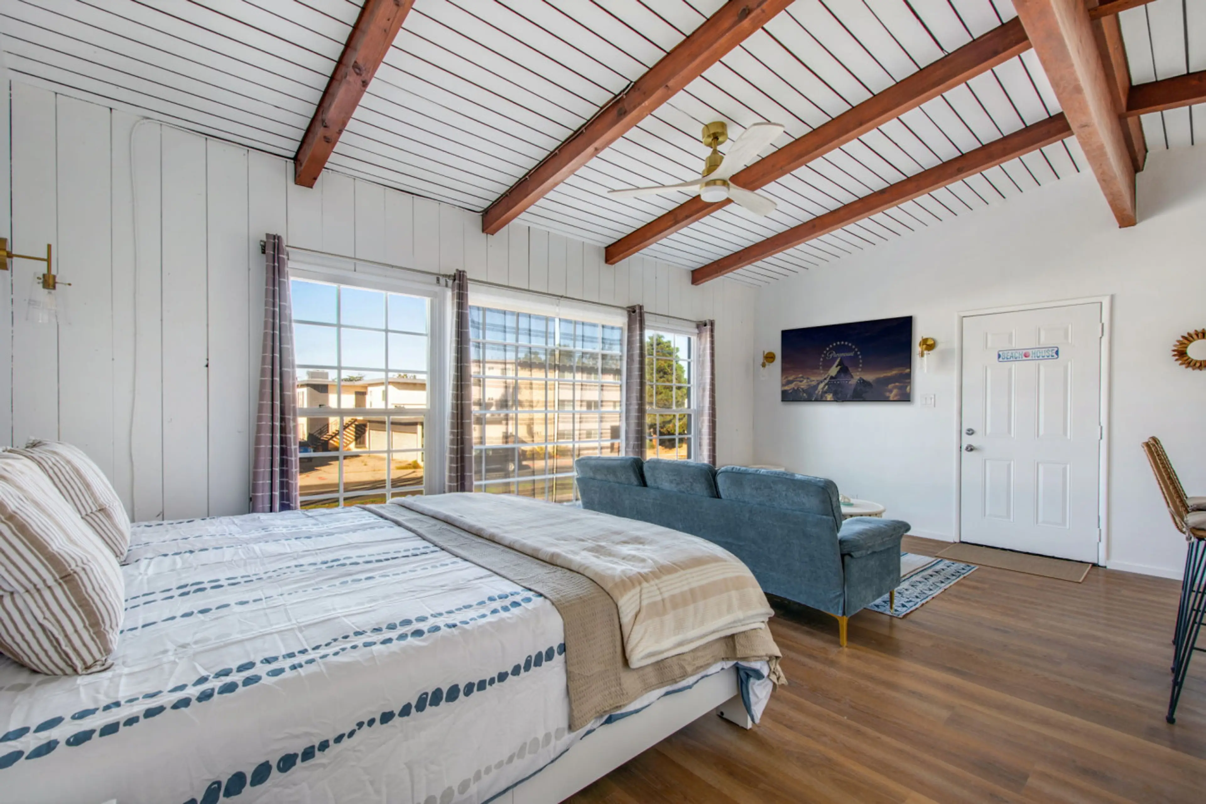 Spacious studio-style room with a plush king bed and comfortable lounge area.