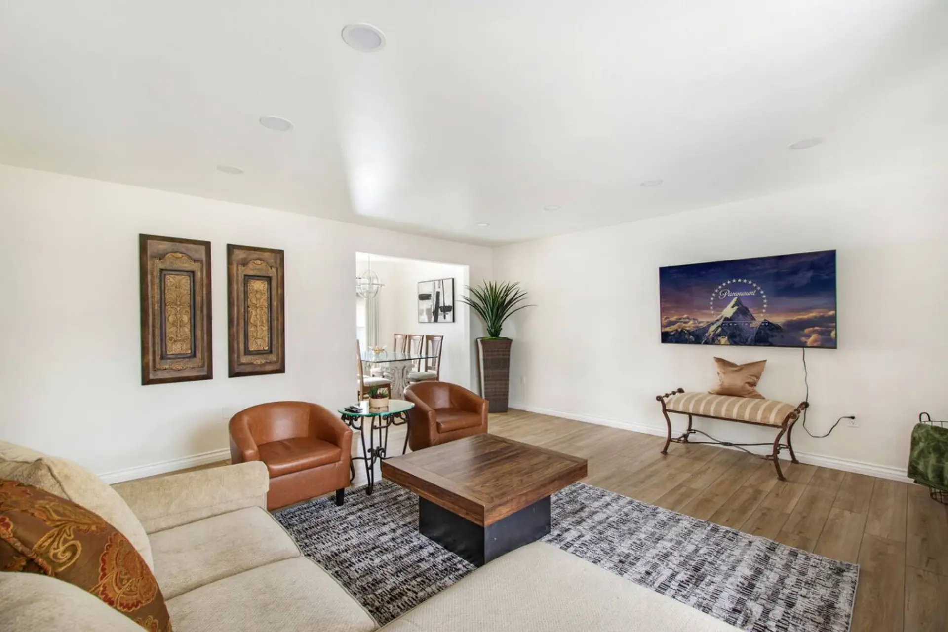 Bright and cozy living room with comfortable seating and Smart TV