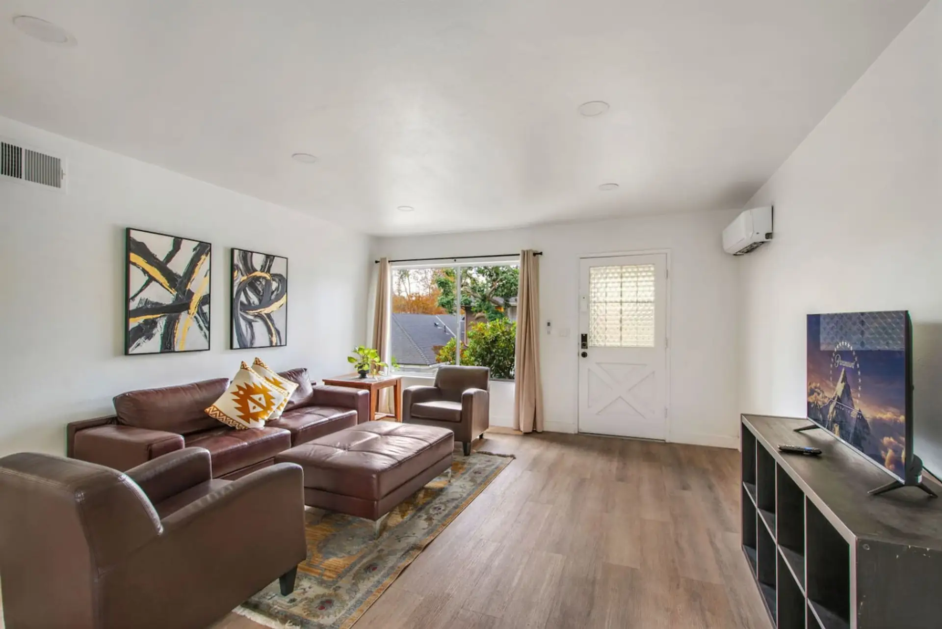 Cozy living room with comfortable seating and a Smart TV for your entertainment.