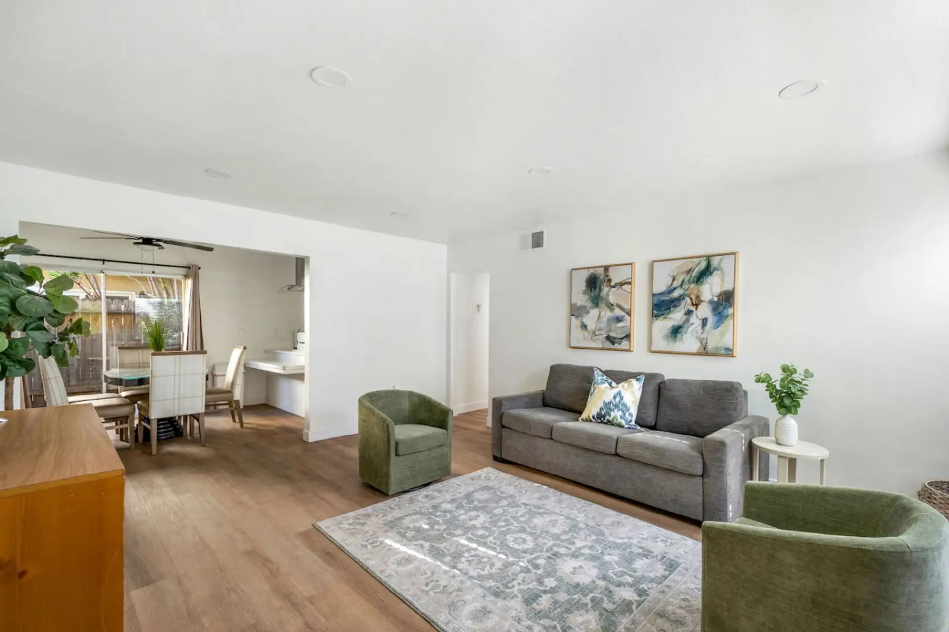 Bright and cozy living room with comfortable seating and a Smart TV