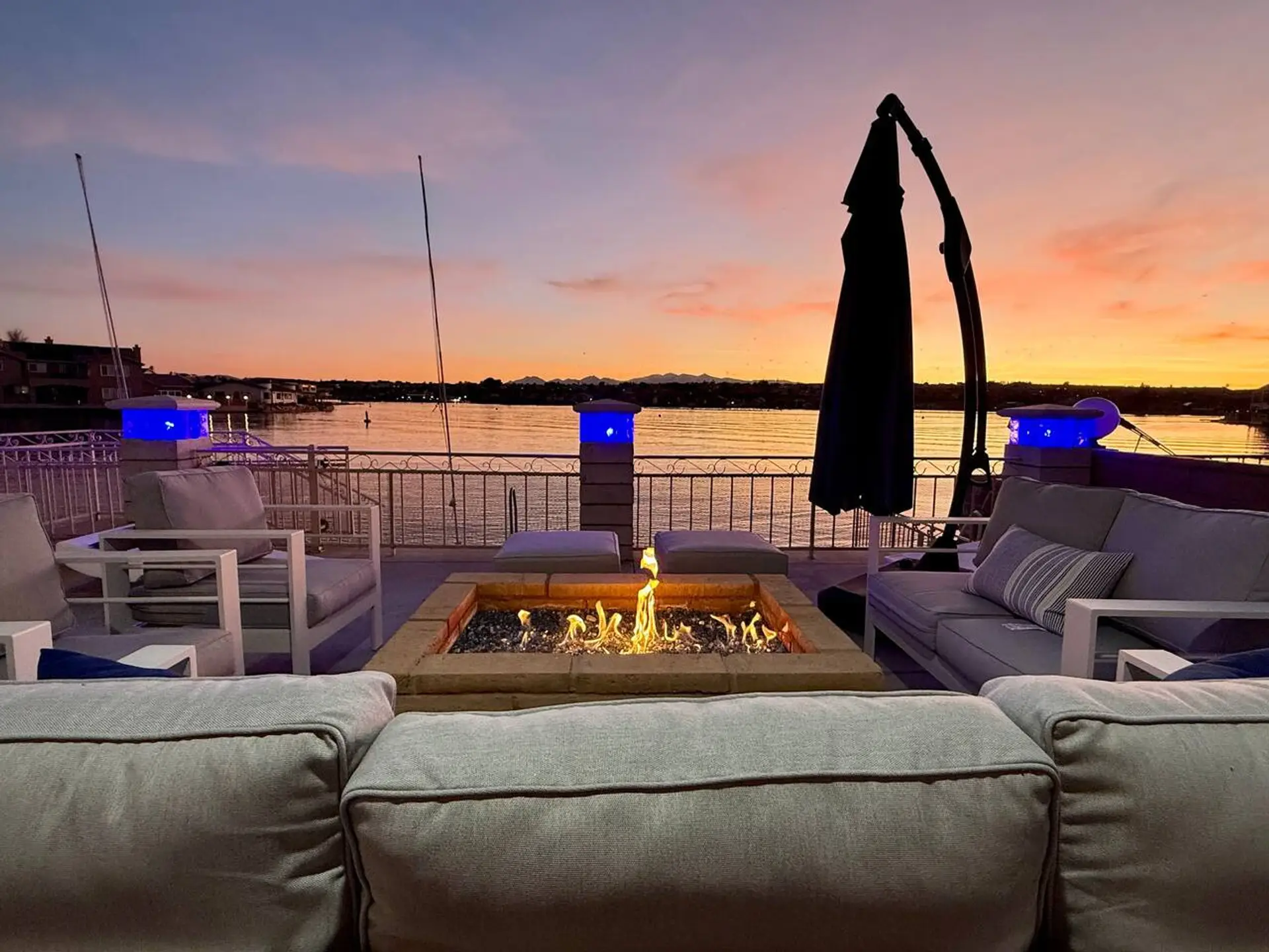 End the day by the fire pit with stunning sunset views over the lake.