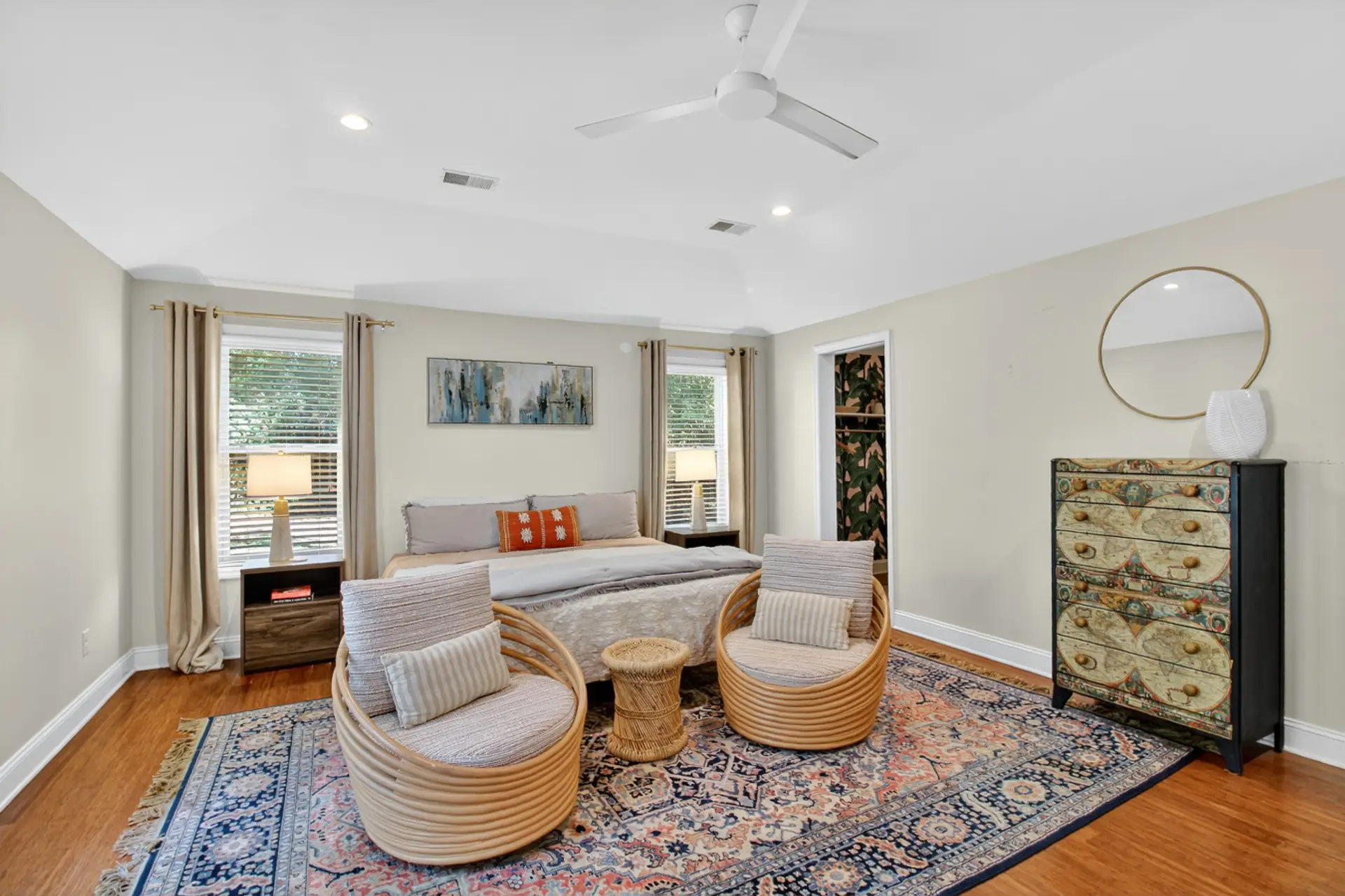 Sink into a plush bed after a day exploring downtown - with vaulted ceilings, a ceiling fan, and those rattan lounge chairs, you might just convince yourself to sleep in.
