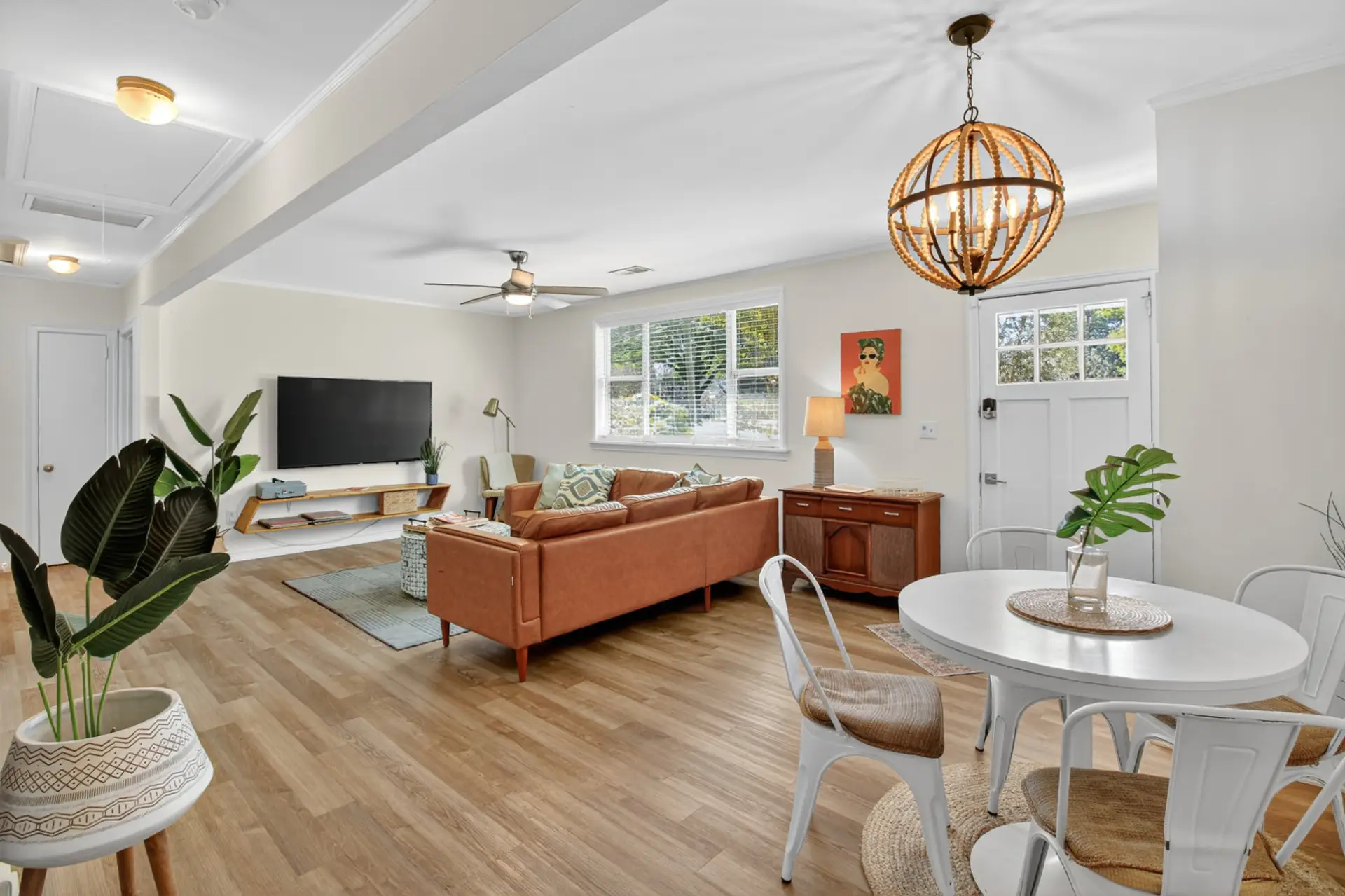 Plenty of room to spread out with a book or gather everyone for game night under that statement chandelier