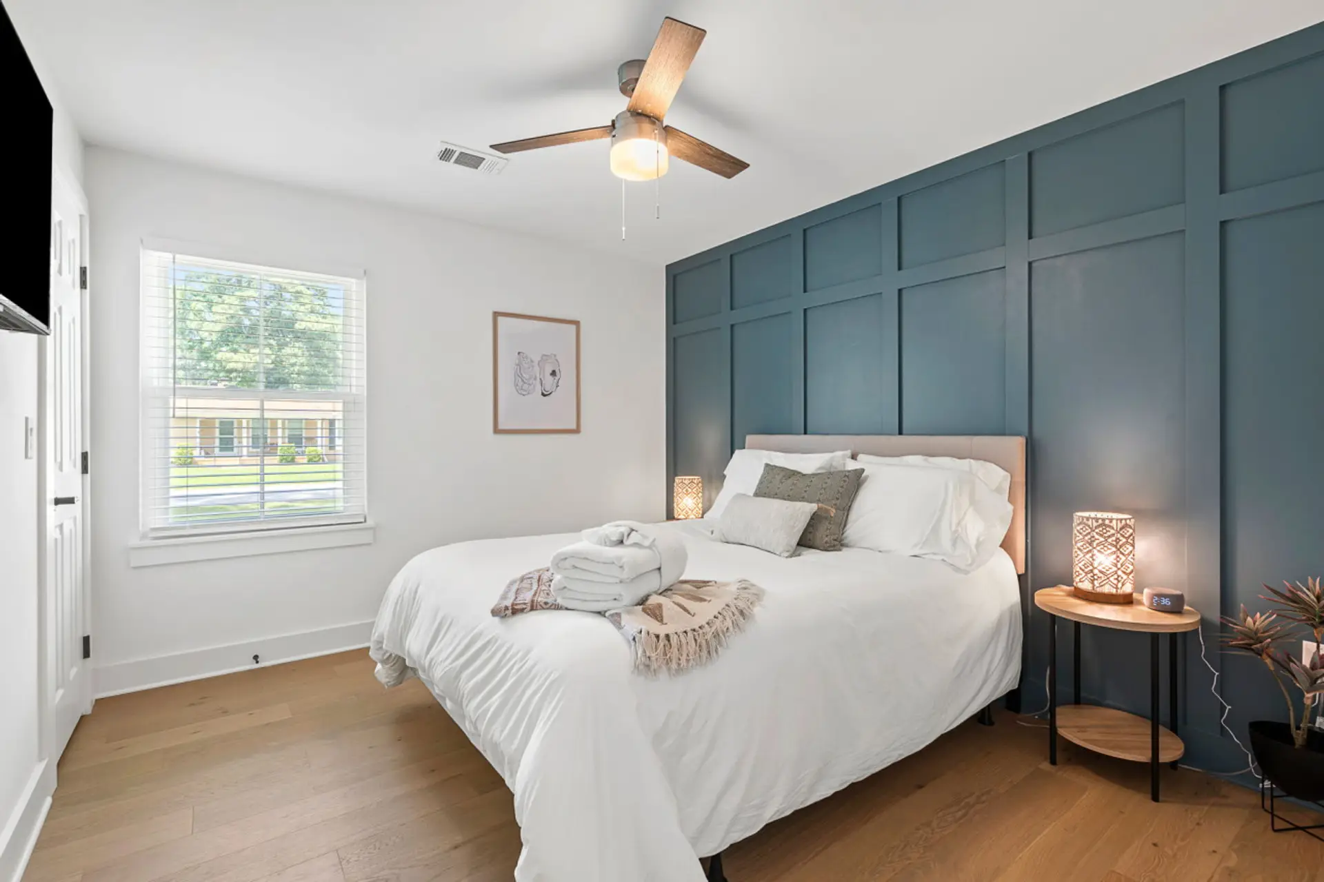 Sink into cloud-soft linens after a day exploring Charleston - the ceiling fan and natural light make this room perfect for sleeping in (we won't tell).