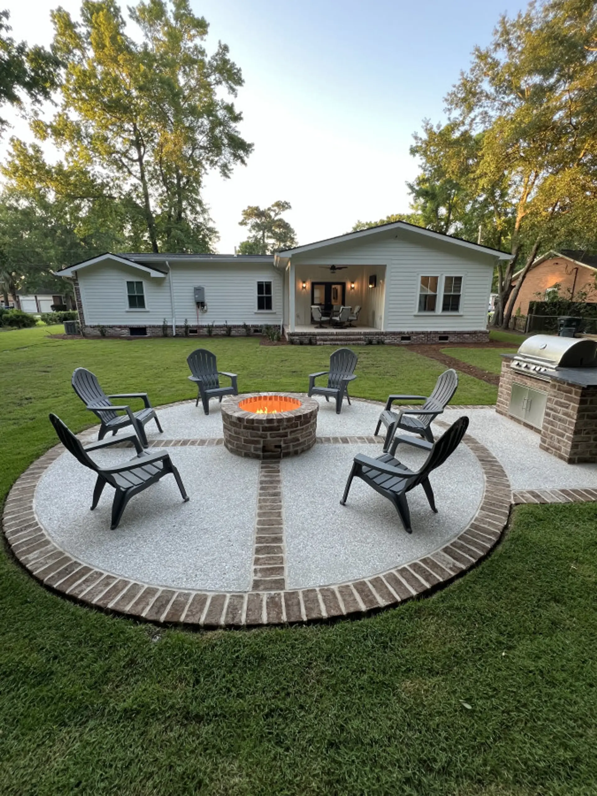 Gather around the brick firepit for s'mores and stories under the Charleston sky - your own backyard oasis with room for everyone to spread out