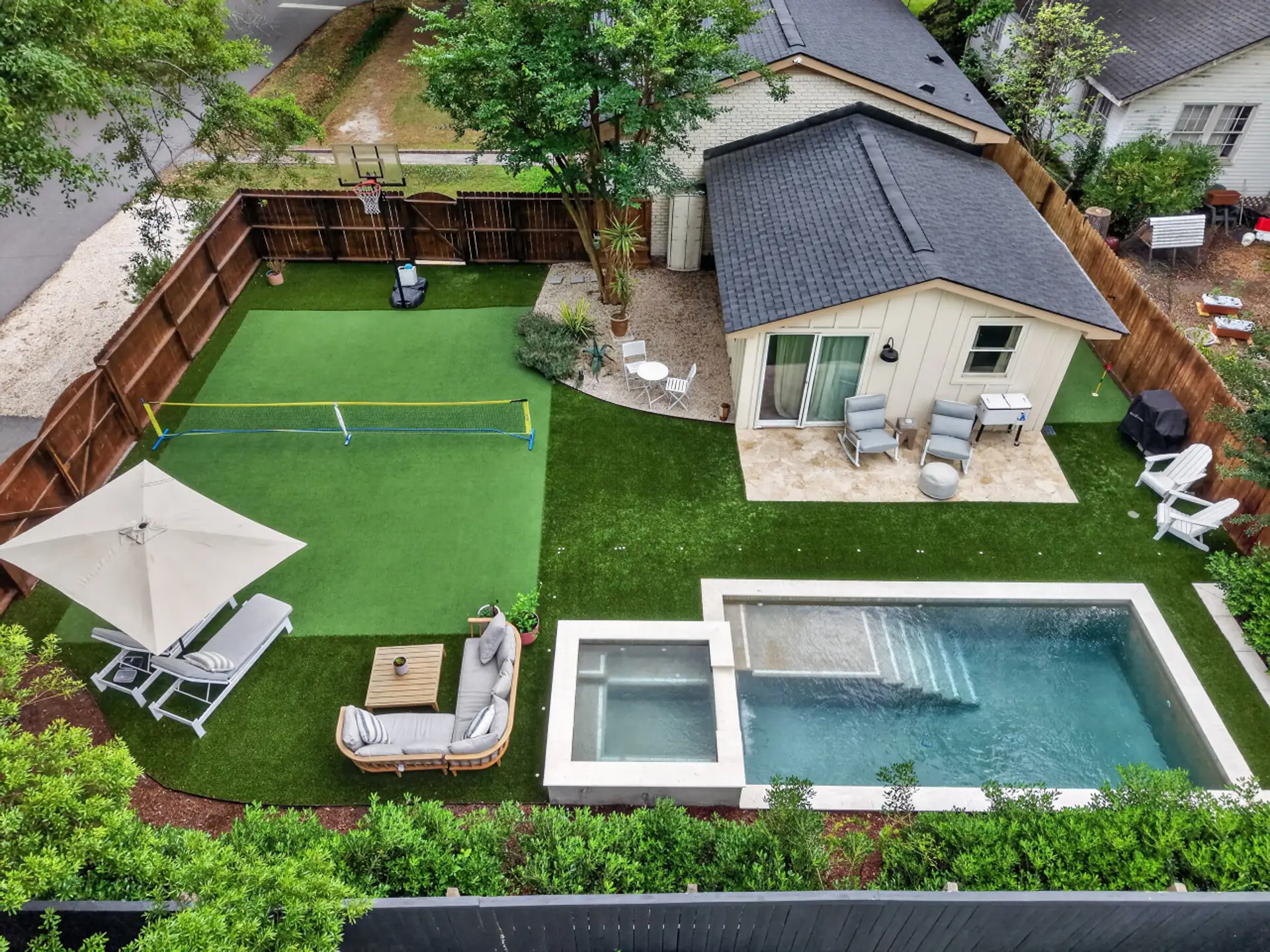 Your own private playground with a sparkling pool, hot tub, sport court, and putting green - because downtime should be just as fun as exploring Charleston