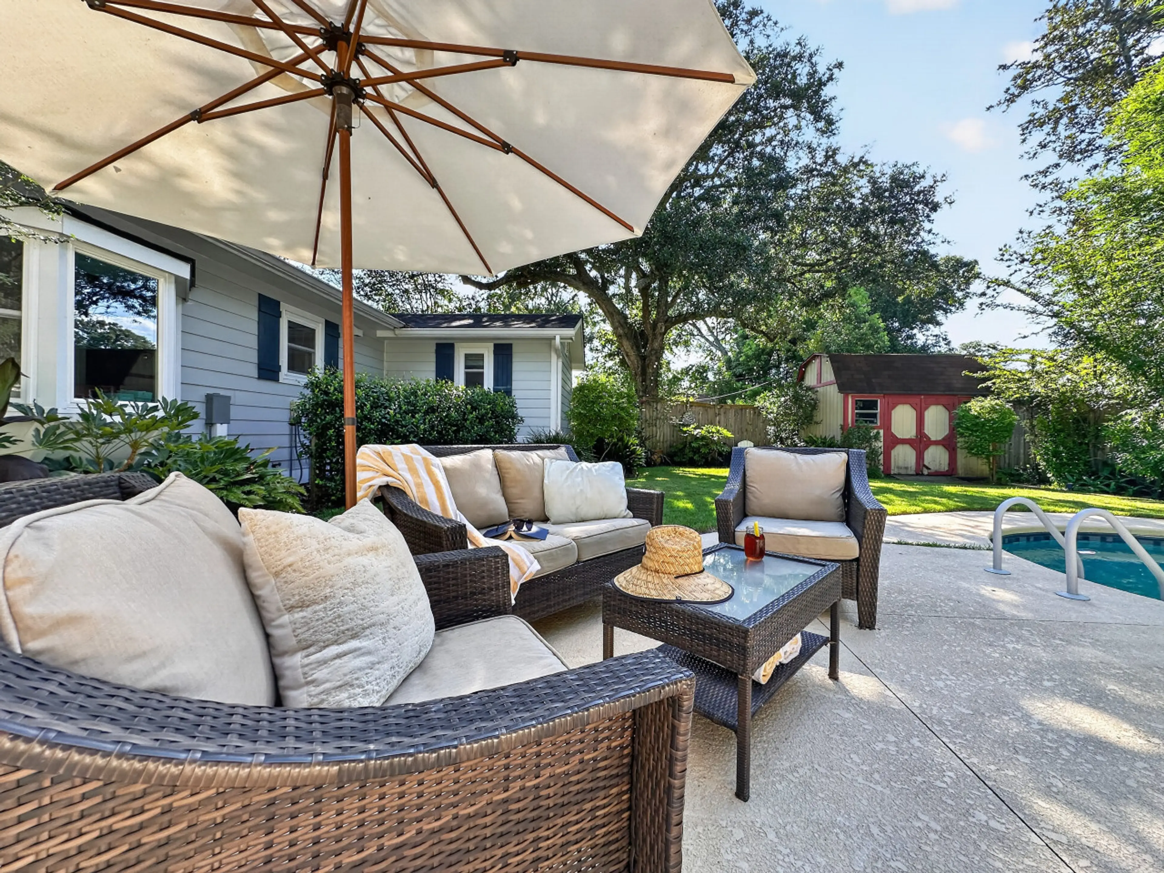 Your own shaded retreat by the pool - lounge under the umbrella with a good book or just soak in the Charleston sunshine from plush seating