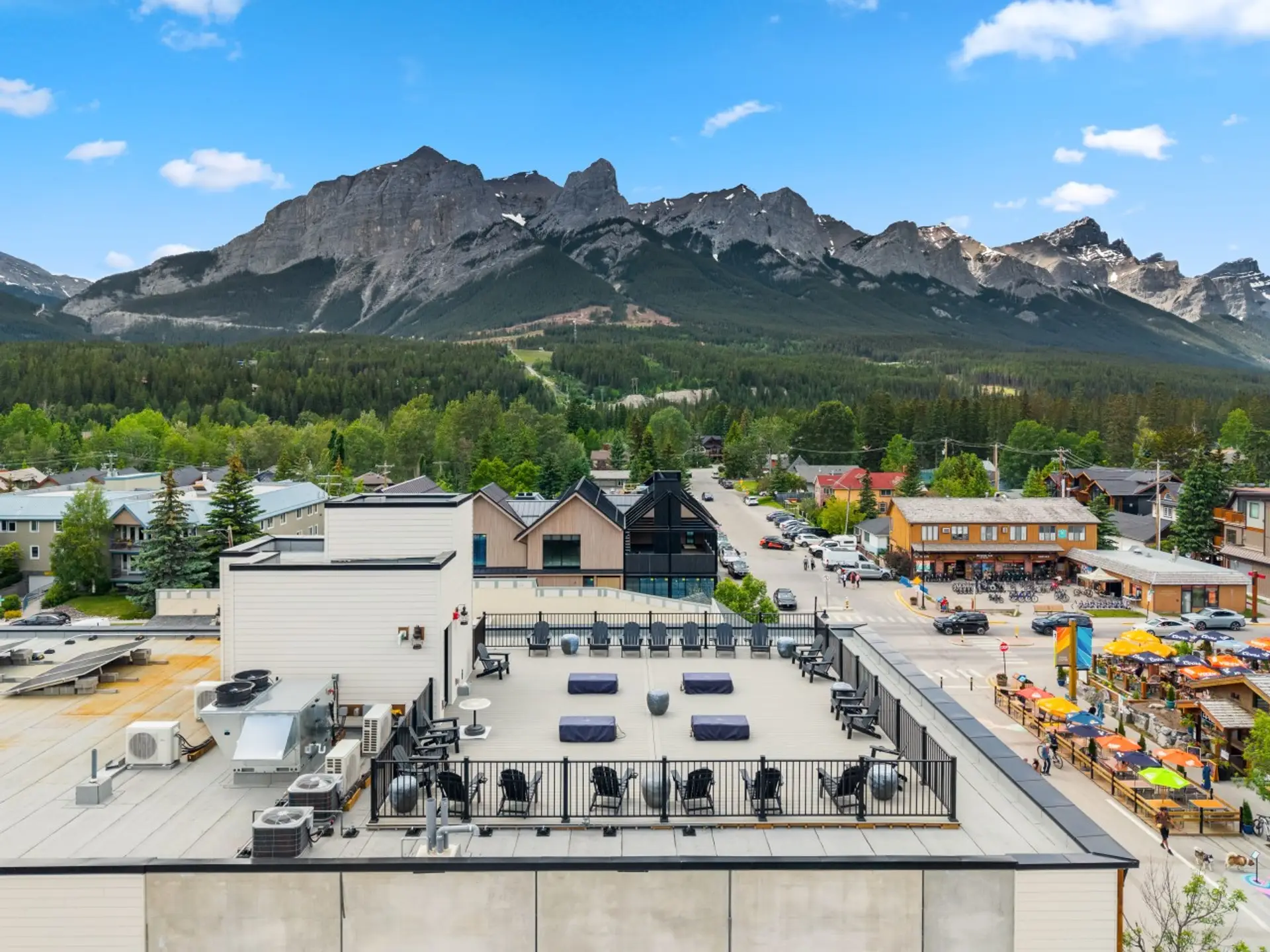 The shared rooftop patio offers panoramic views across downtown Canmore.