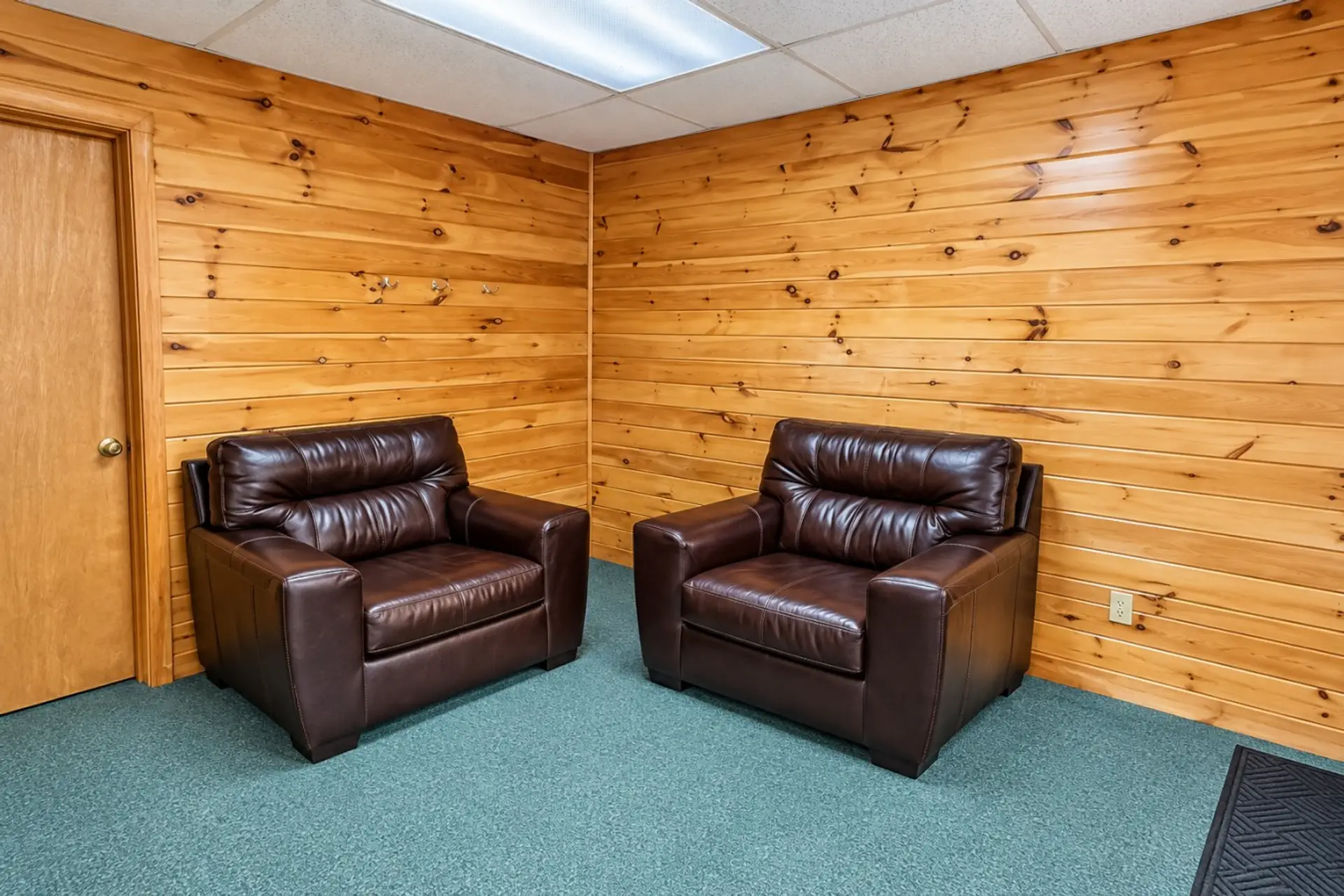 Cozy Pine Waiting Room with Leather Chairs