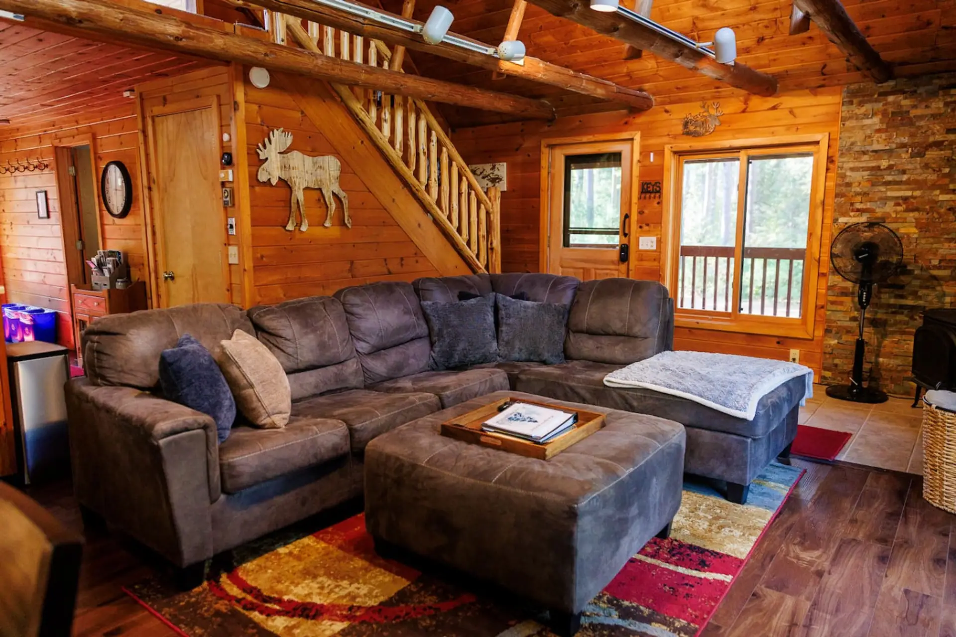 Open Living Room | Great views of the woods | Super comfortable sectional couch w/ Queen sleeper sofa | Dogs welcome!
