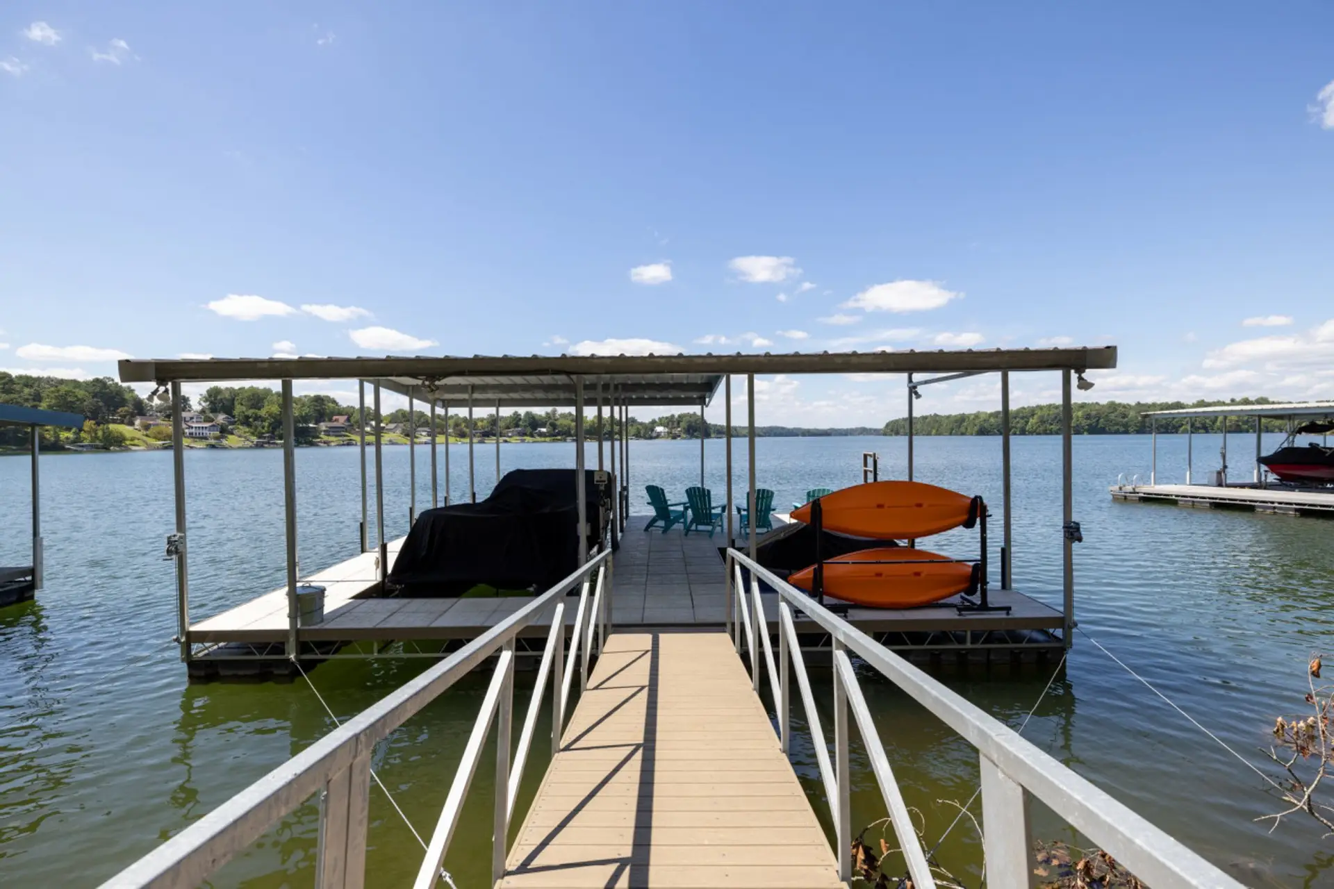 Your Dock with sitting area, kayaks, and fish food for kids