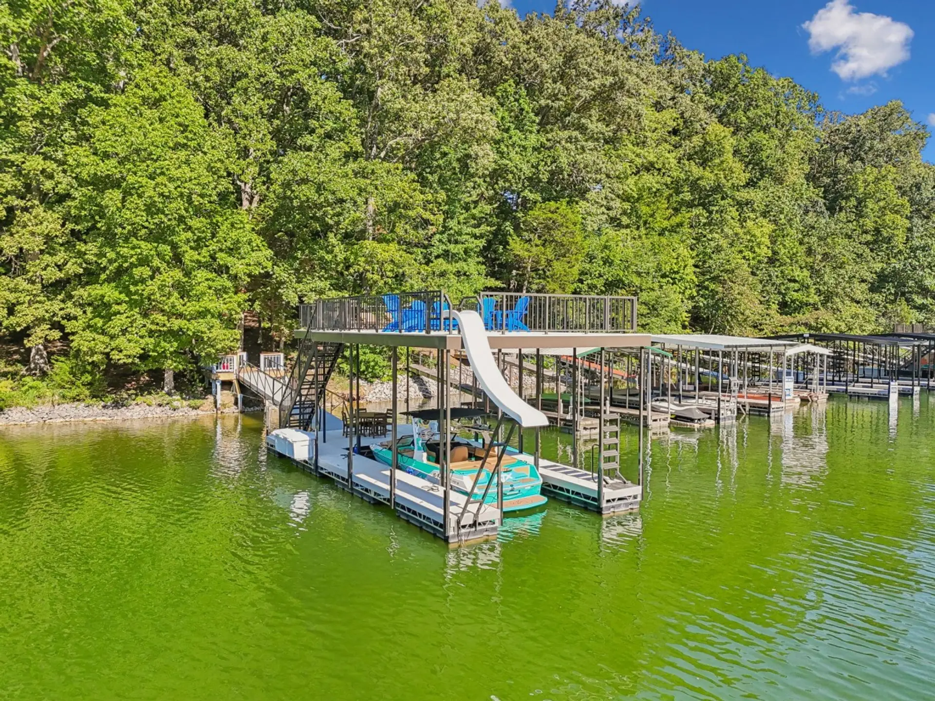 Enjoy your double decker dock with slide, slip, lily pad, and 2 kayaks