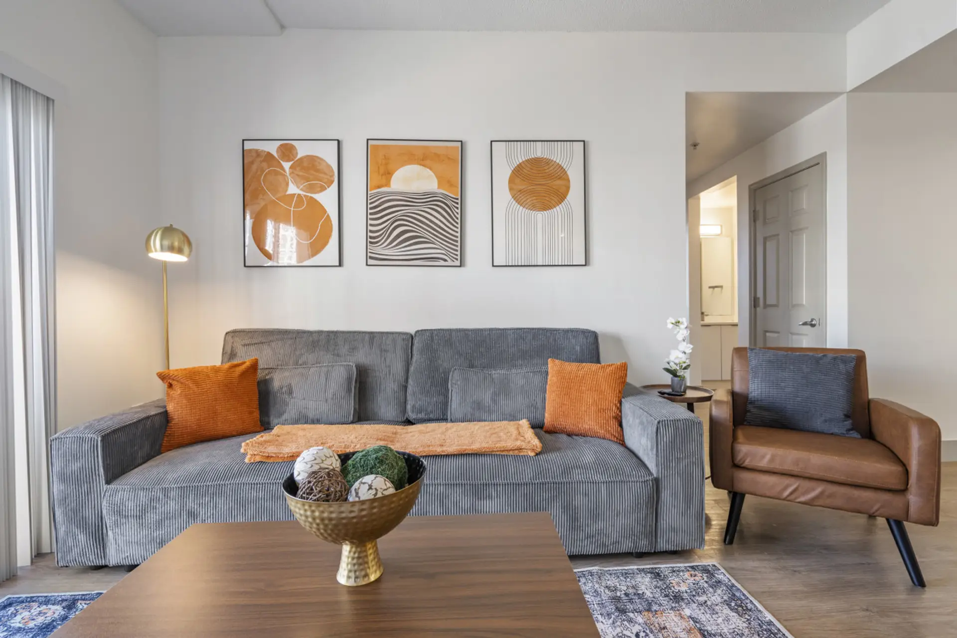 Unwind in the spacious living area complete with a comfy couch to relax after a long day exploring the city!
