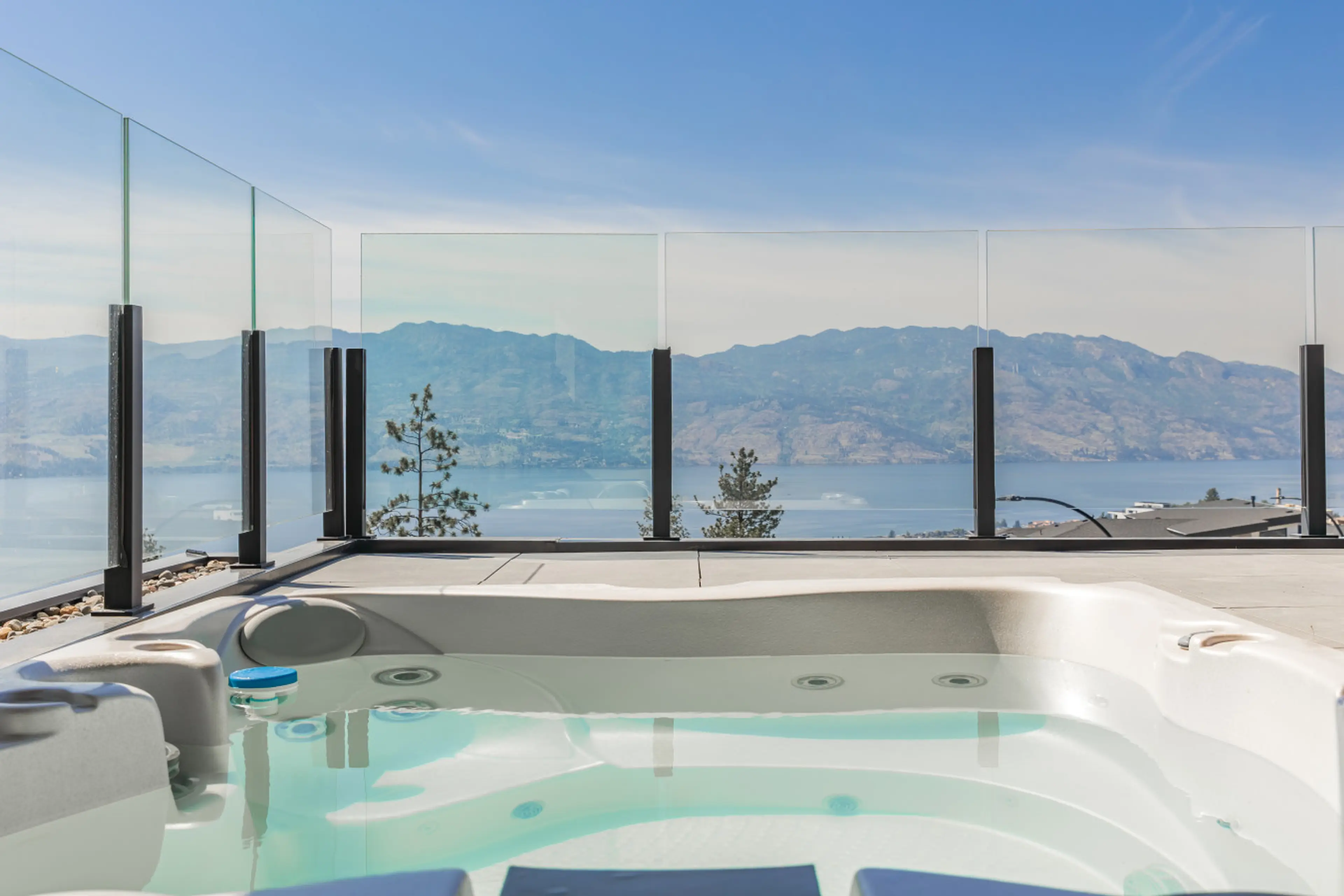 Lake views right from the hot tub! Come experience Kelowna at its finest!