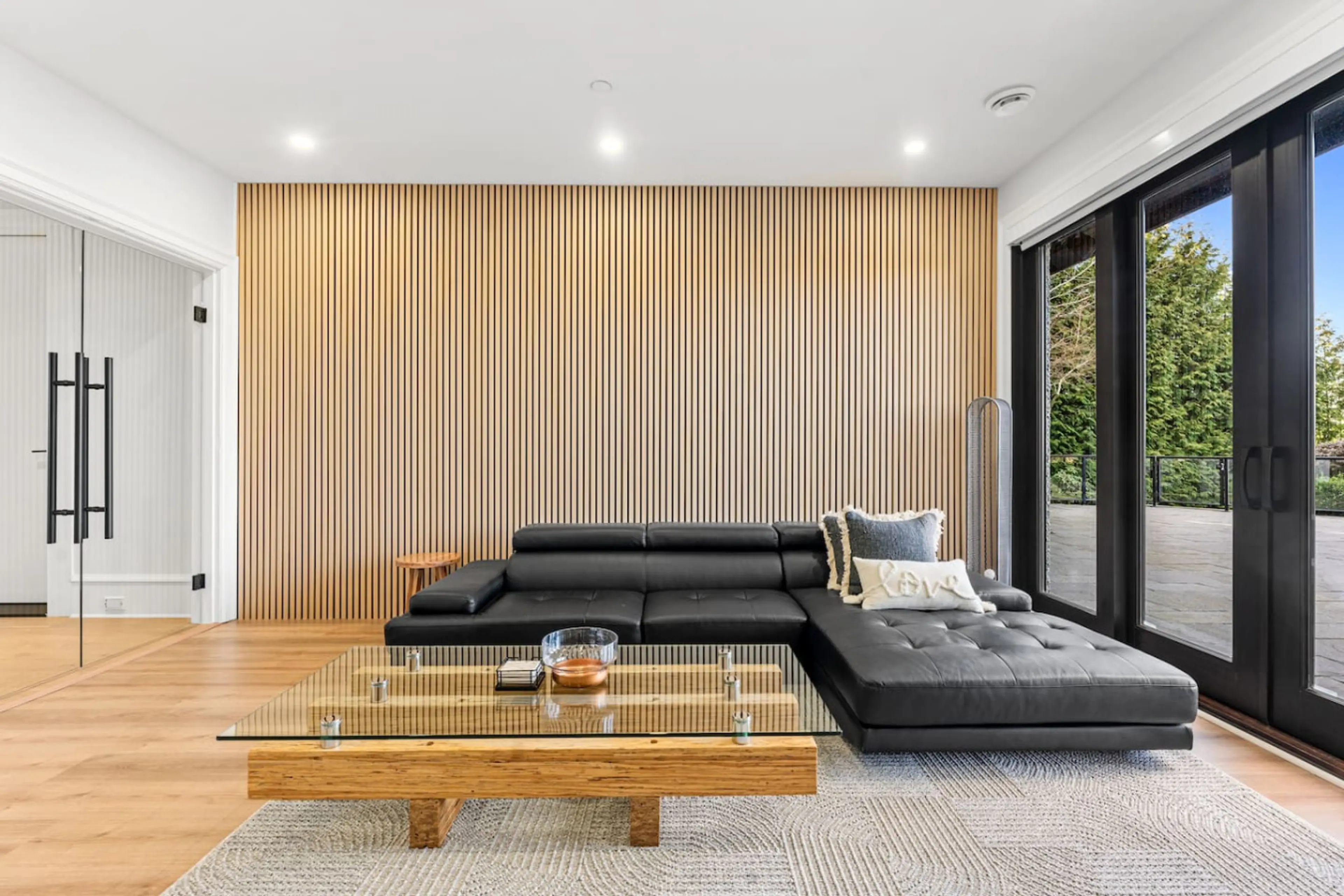 Stunning woodslat wall paired with open-concept design and tall glass windows, bringing natural light and modern elegance to your space. 🌿✨ #WoodslatWall #OpenConceptLiving #ModernDesign #NaturalLight